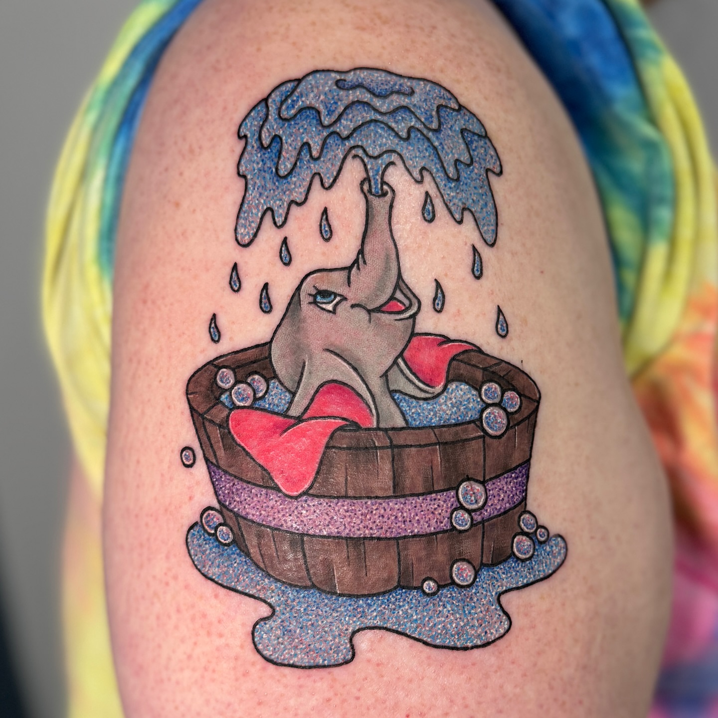 Elephant in bathtub new school tattoo on the upper arm by Ashley Rose - Minnesota Tattoo Artist