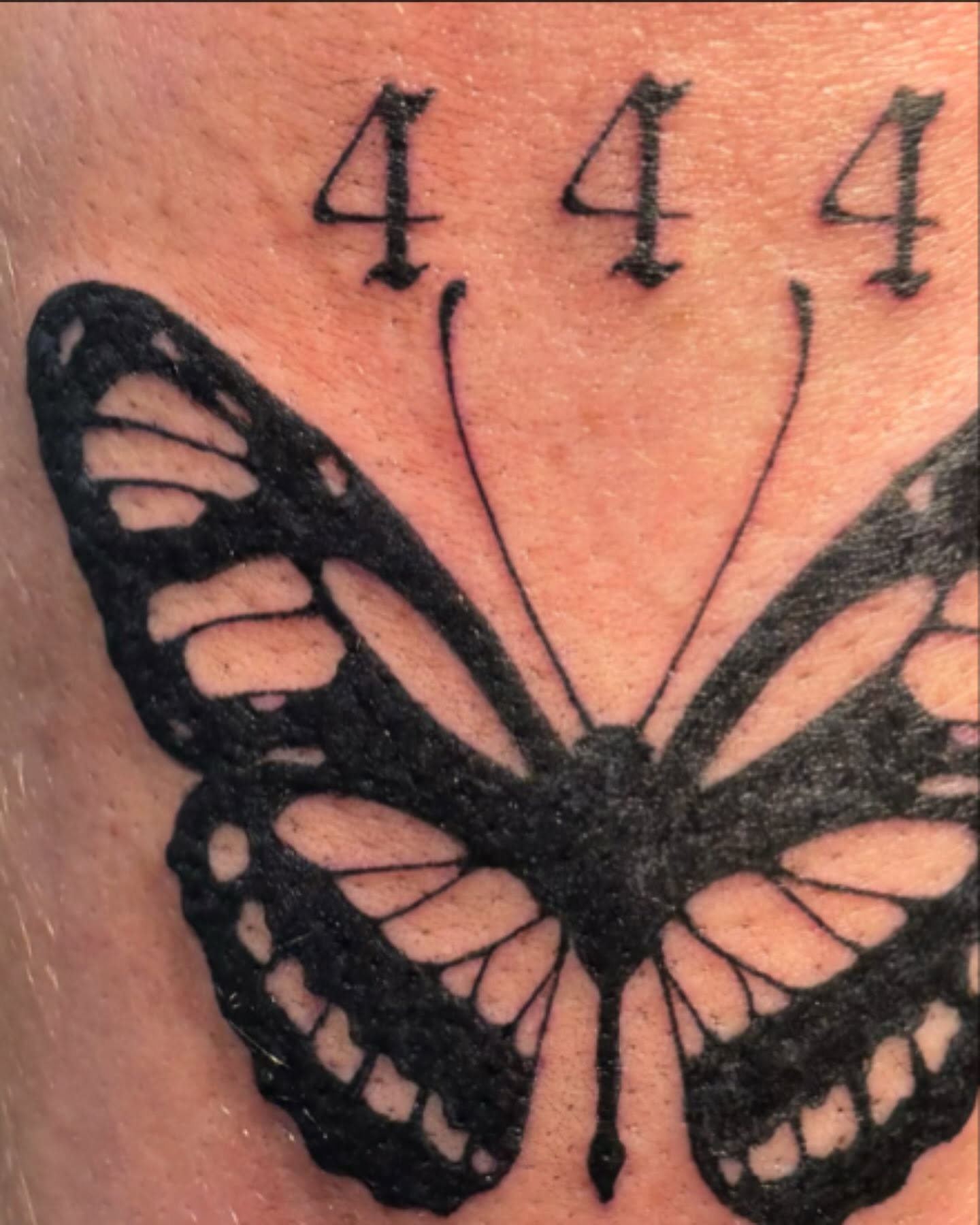 Butterfly black and grey tattoo on the forearm by Anna Kathleen, Des Moines, Iowa
