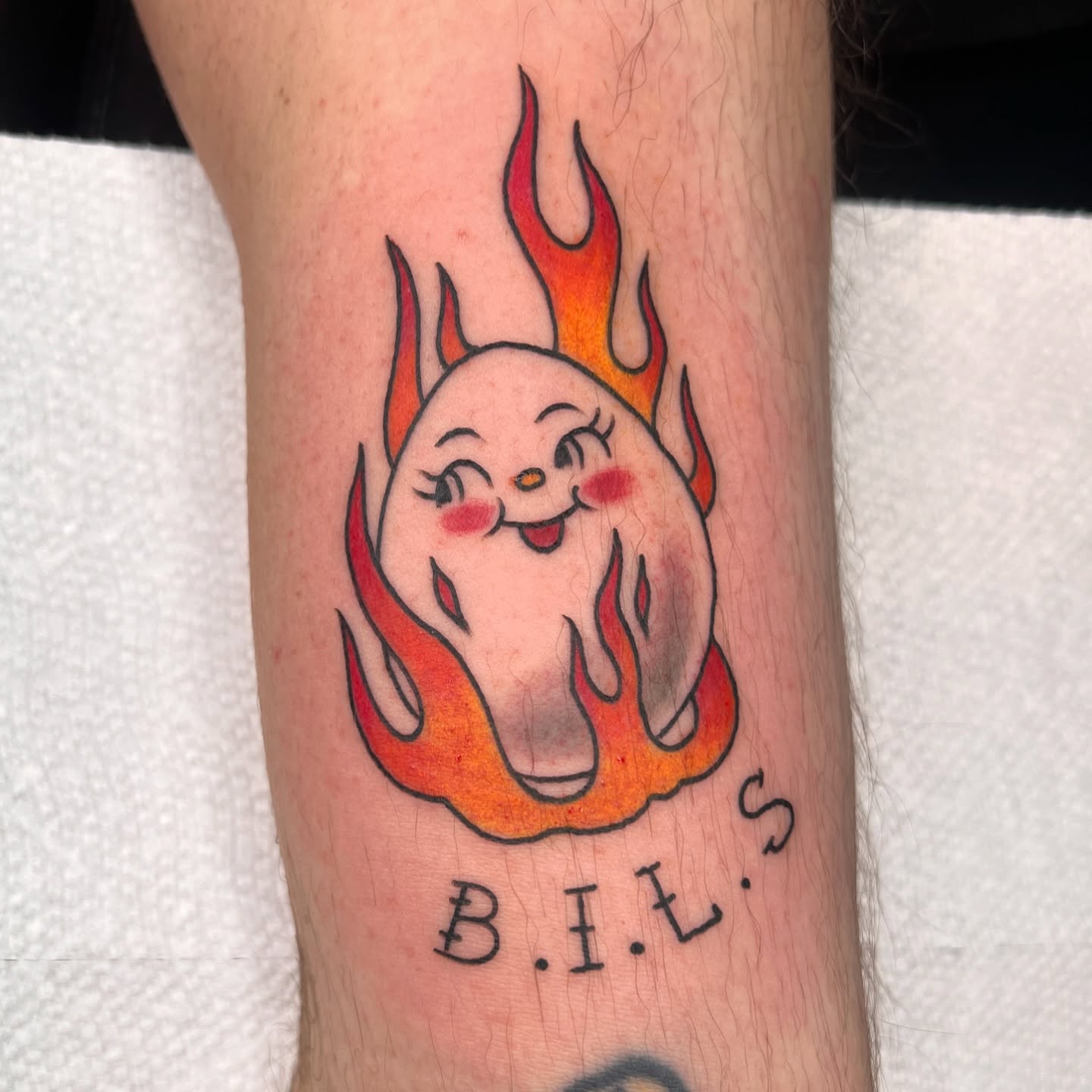 Flaming ghost new school tattoo on the forearm by Tattoo & Body Artist, Gastonia, North Carolina