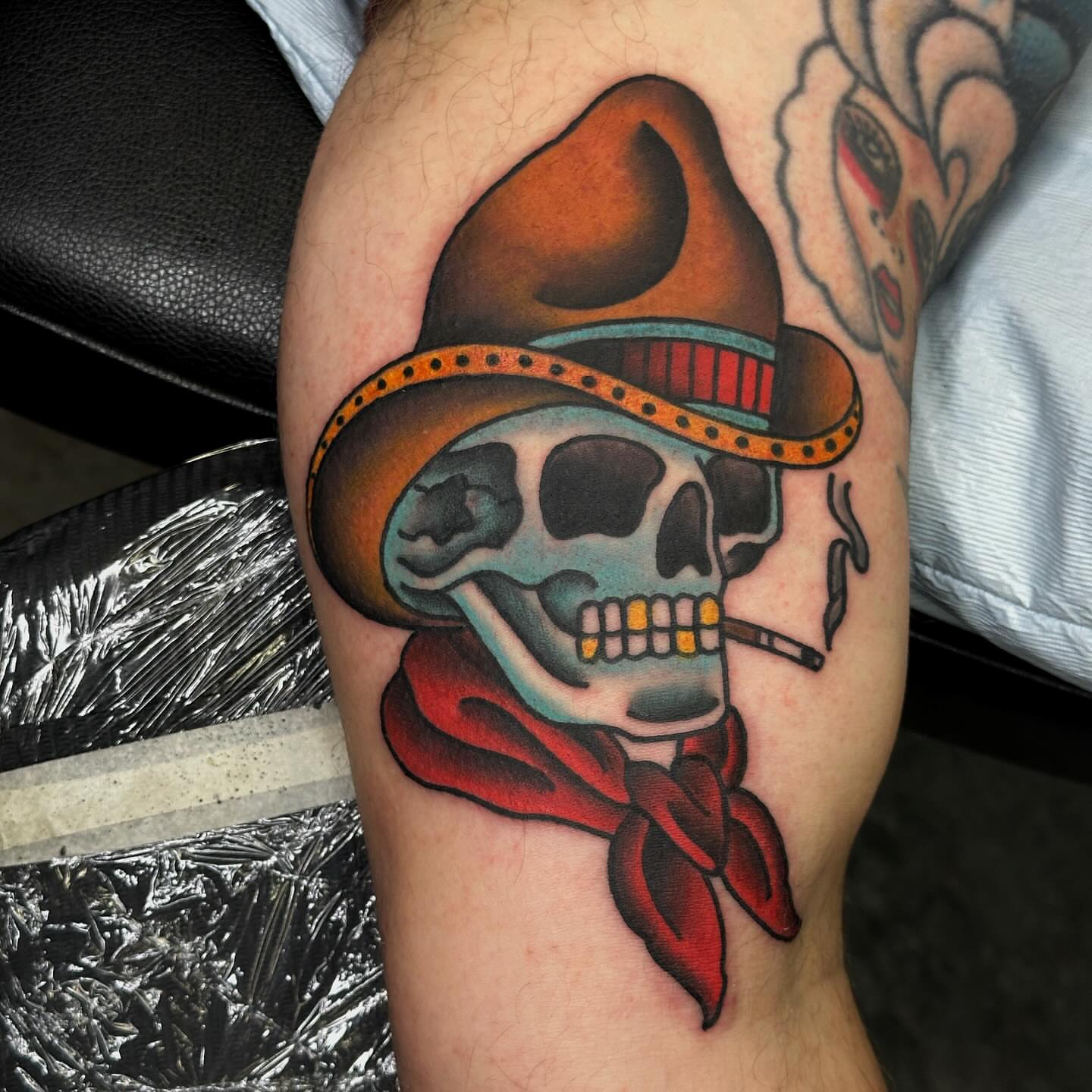Skull wearing sombrero American traditional tattoo on the thigh by Elizabeth Tabler