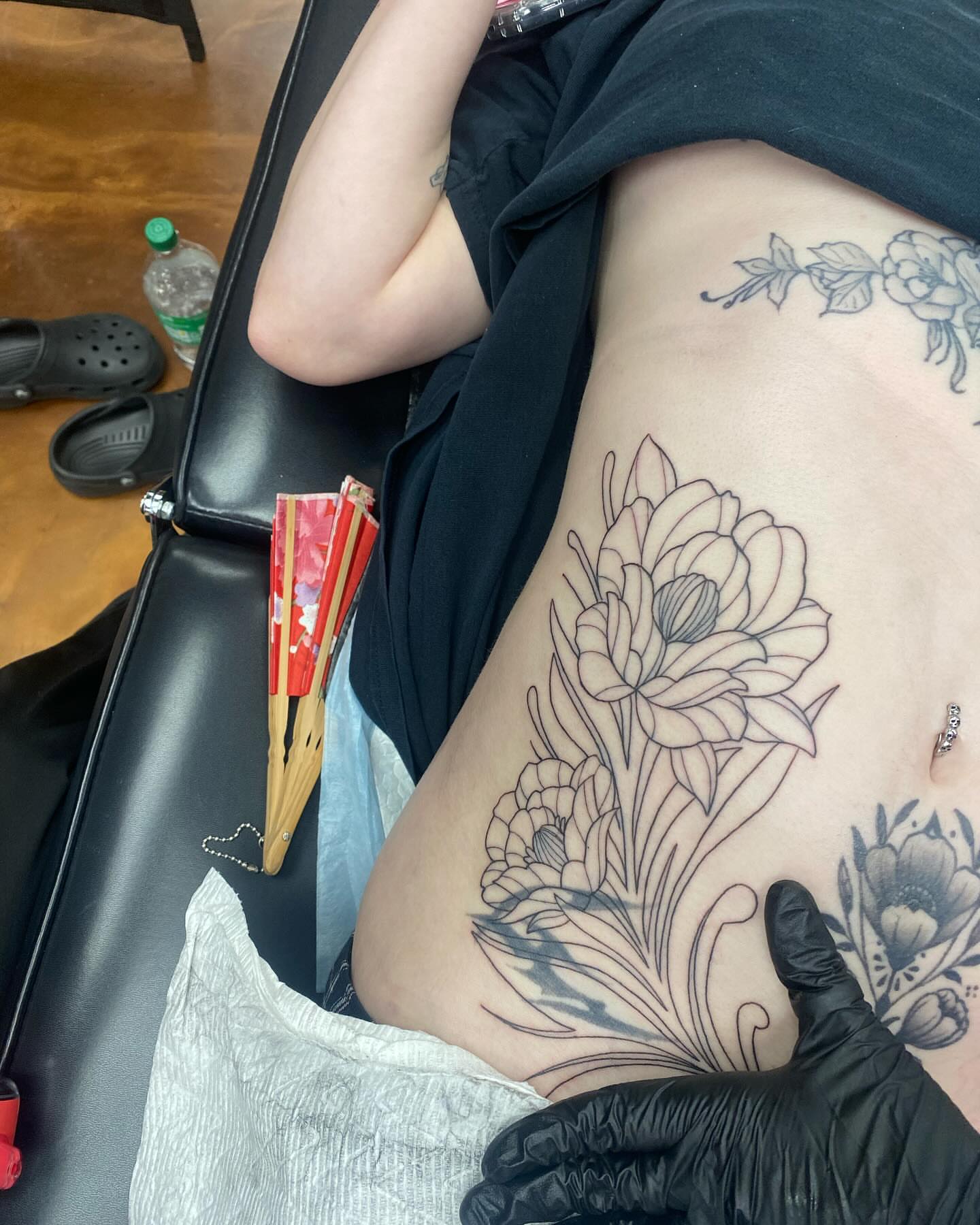 Floral arrangement black and grey tattoo on the thigh by QUEEN TATTOO Stephanie Larson