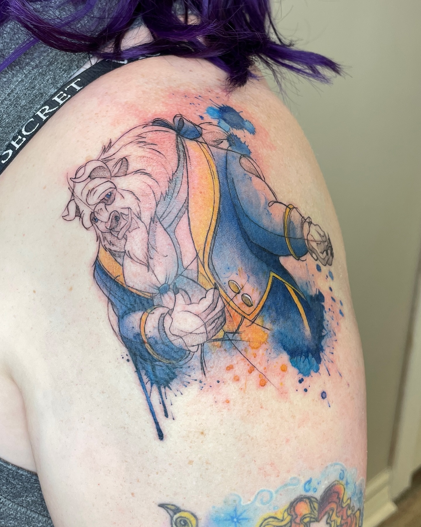 Beast from Beauty and the Beast watercolor tattoo on the shoulder by Melissa Rose Moya
