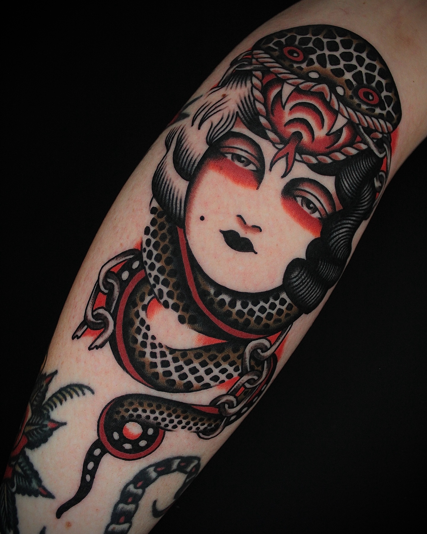 Woman with snakes American traditional tattoo on the forearm by Dustin Stemen, Charlotte, North Carolina