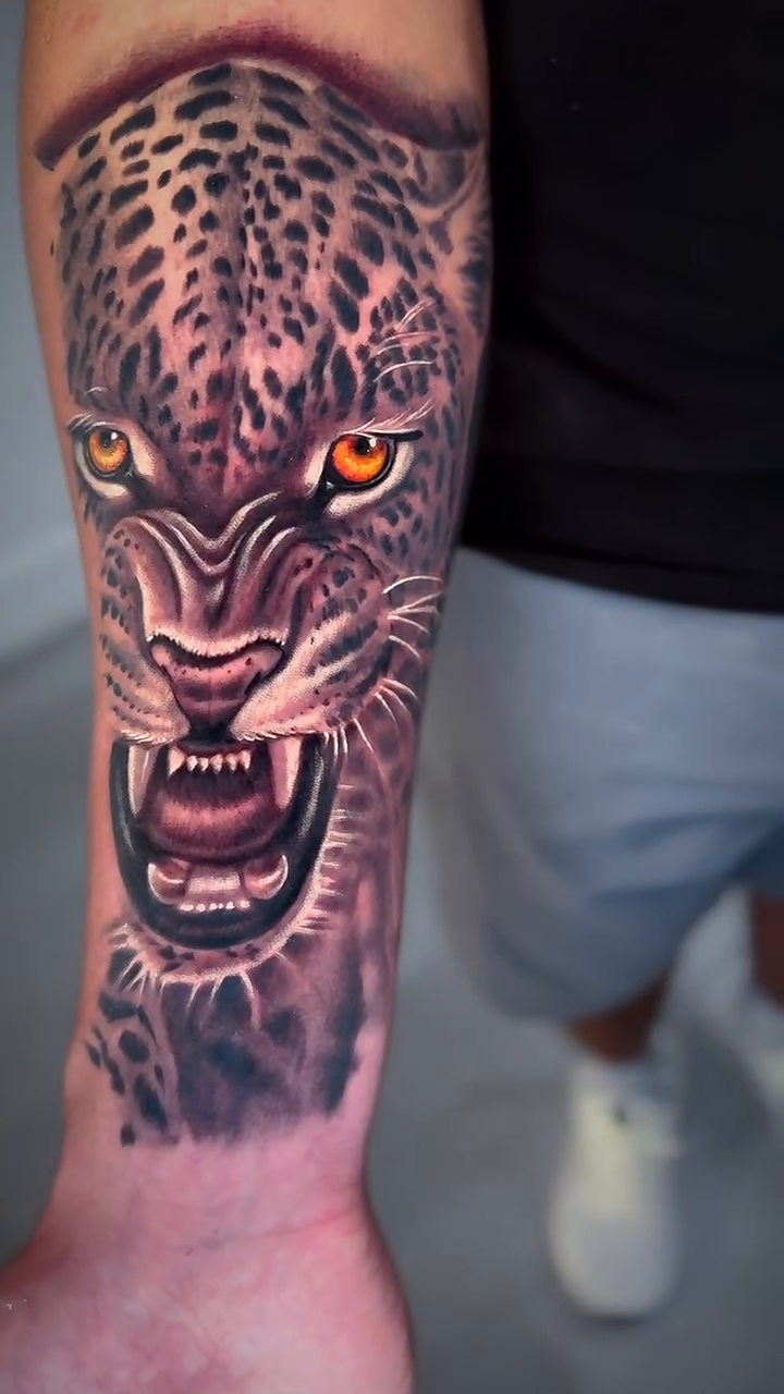 Leopard head realism tattoo by Amaury Ramirez