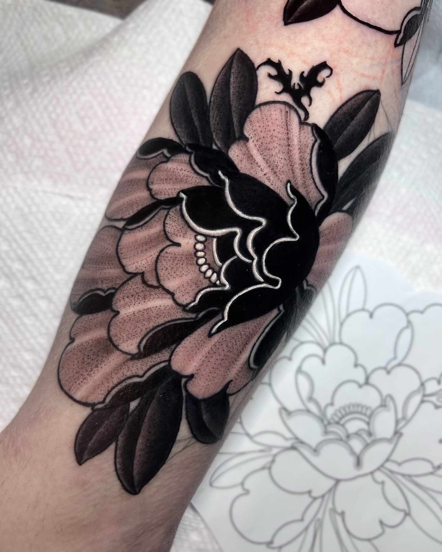 Peony American traditional tattoo on the forearm by Melissa Brown