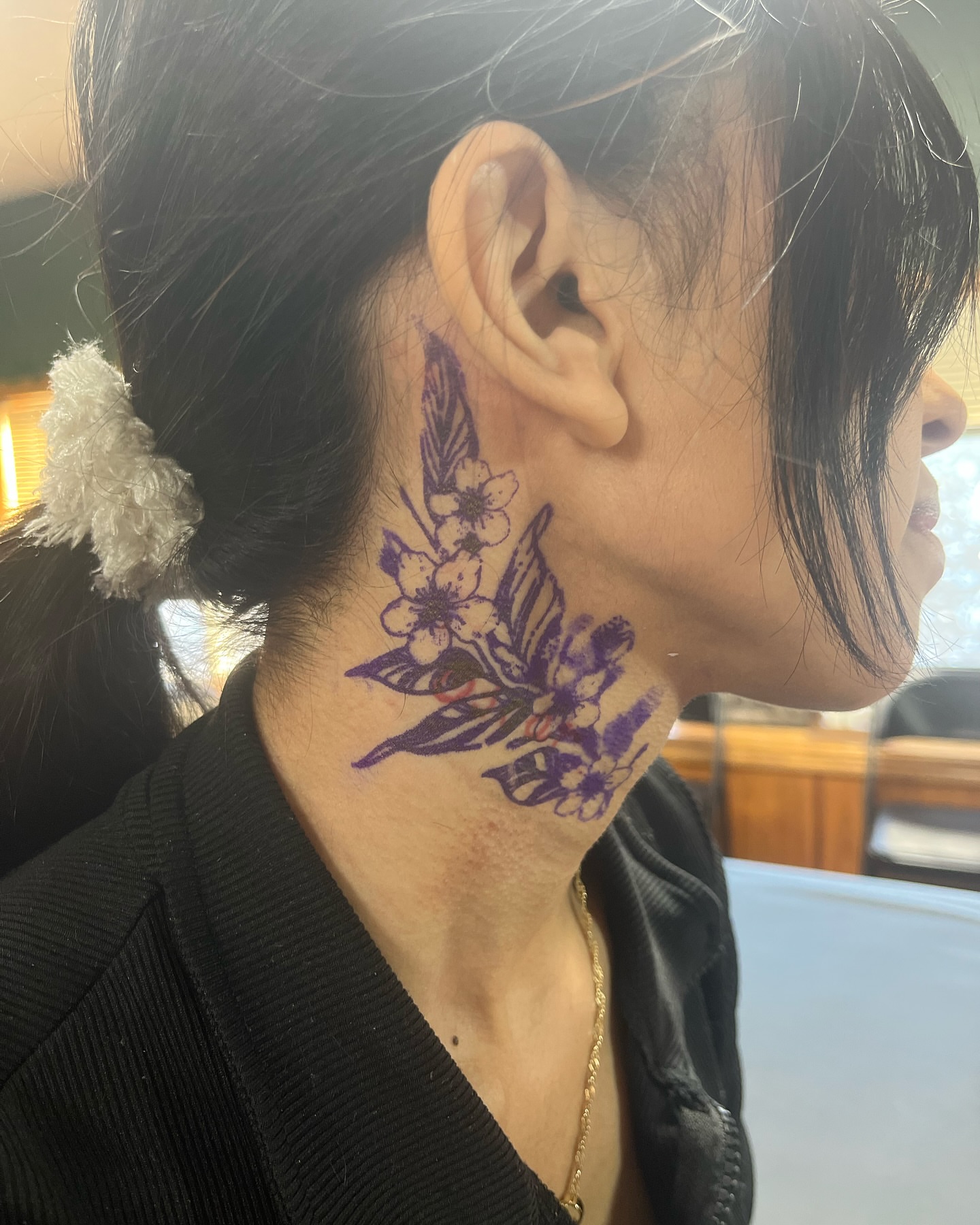 Flowers and butterfly new school tattoo on the neck by Michelle