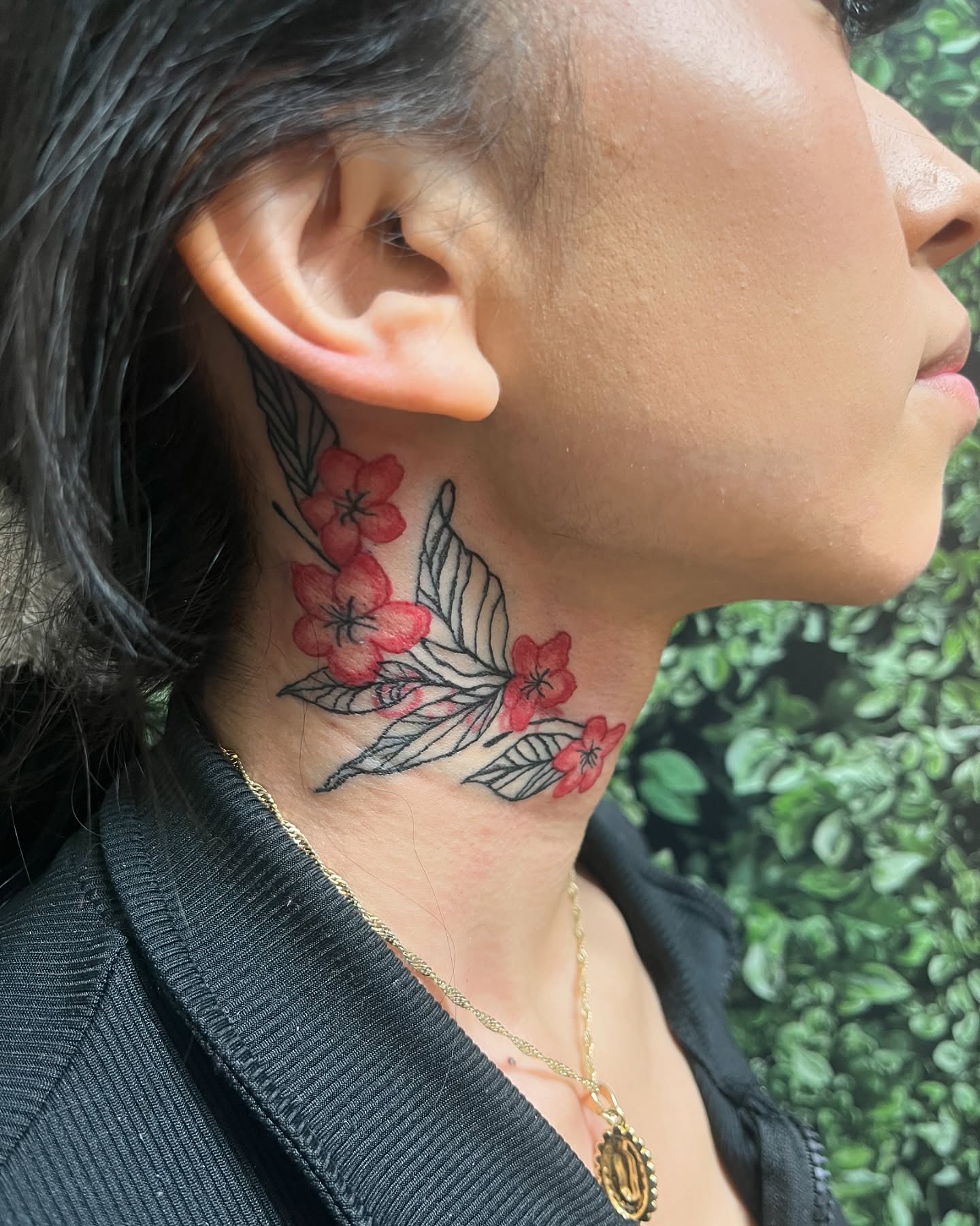 Flowers and leaves black and grey tattoo on the neck by Michelle