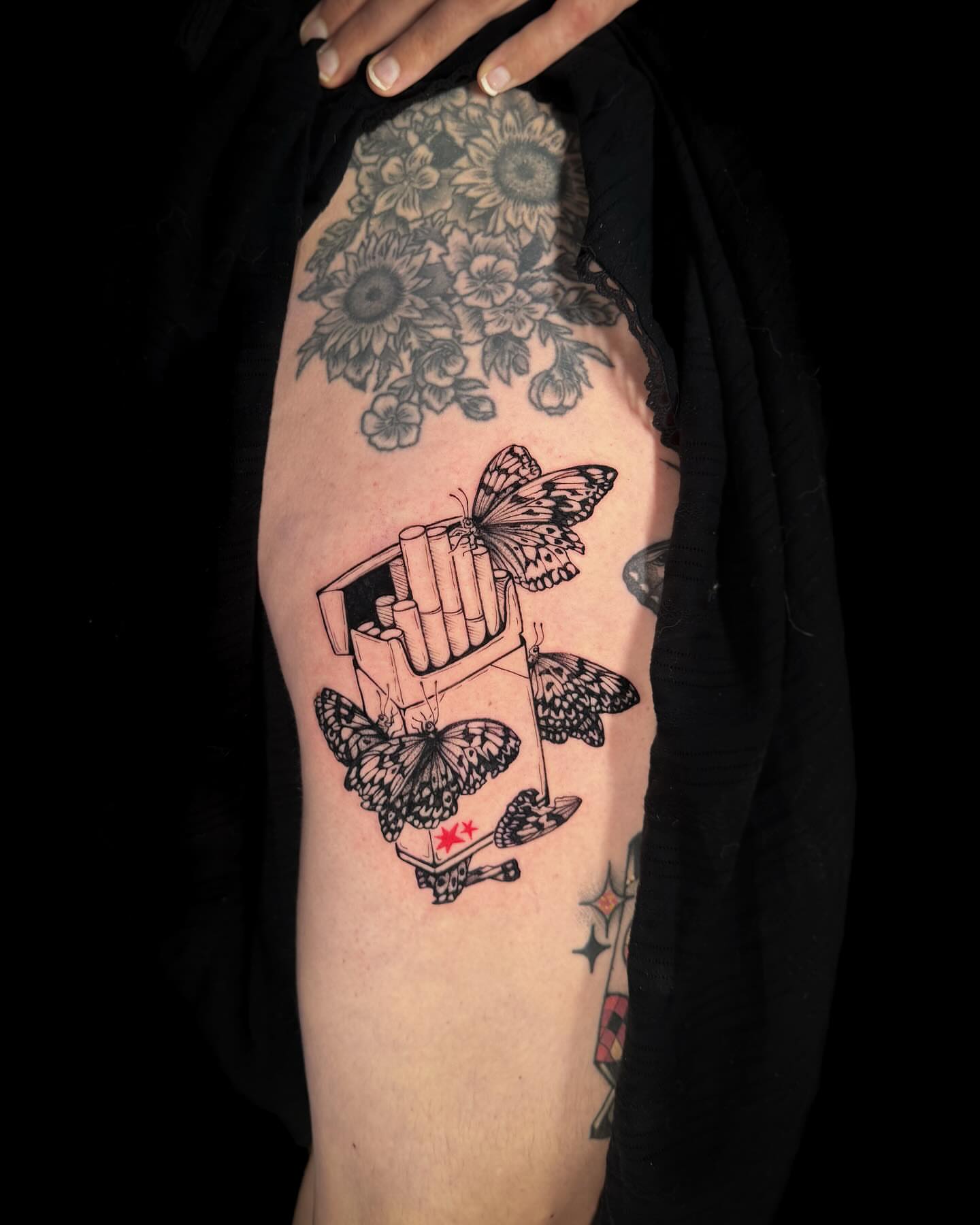 Cigarette box with butterflies black and grey tattoo on the thigh by Renee (Koi) Vance