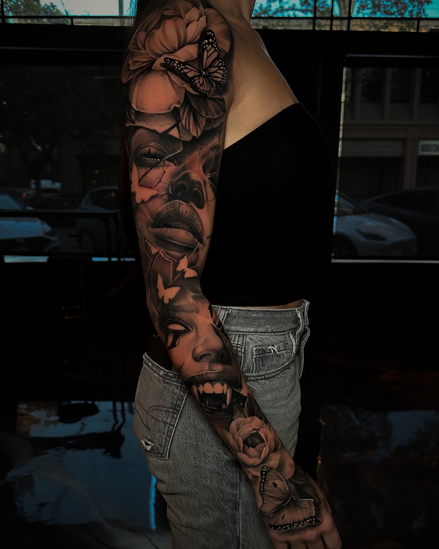 Woman's face realism tattoo on the forearm by Nick Stratt