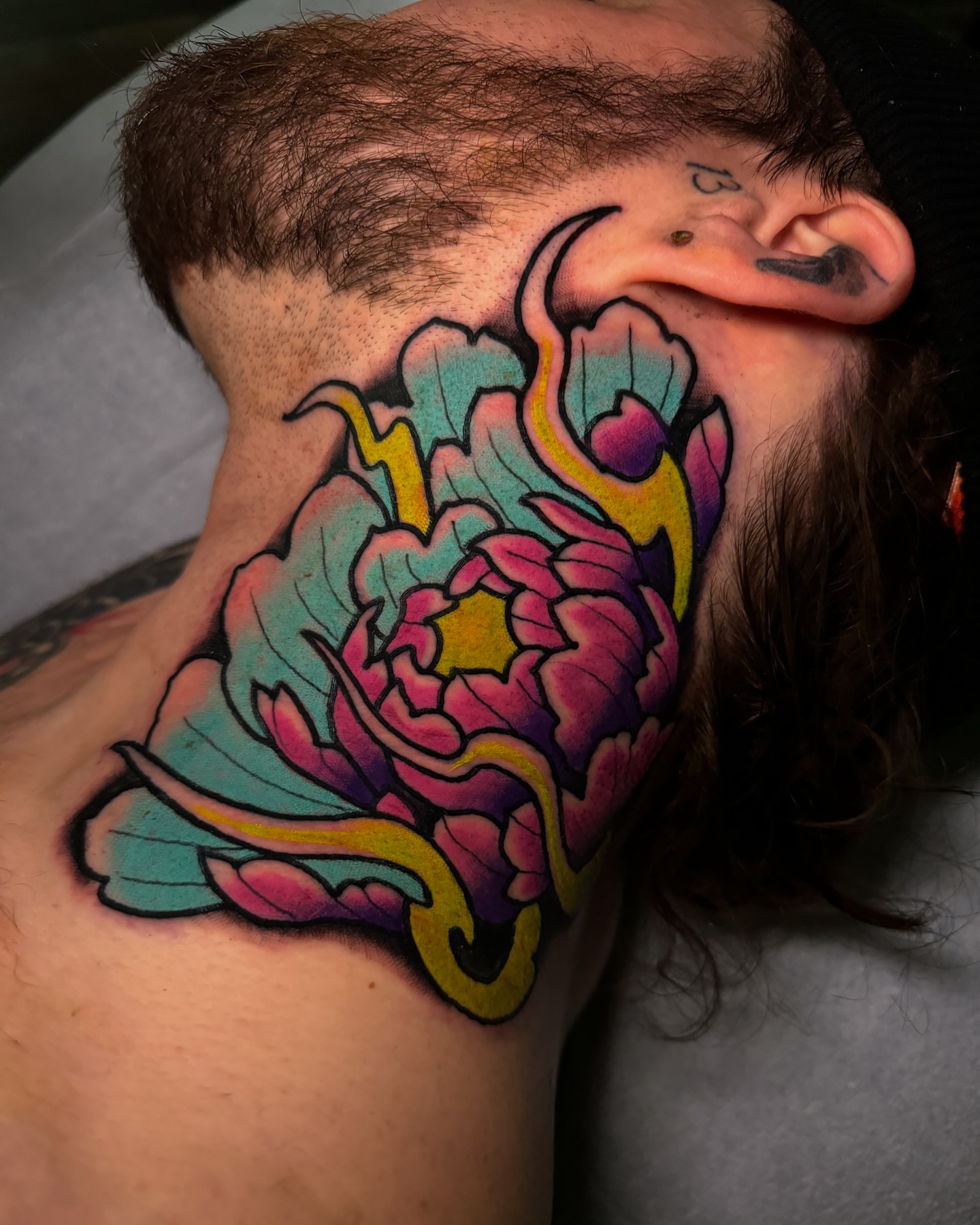 Peony new school tattoo on the shoulder by Cory Cartwright