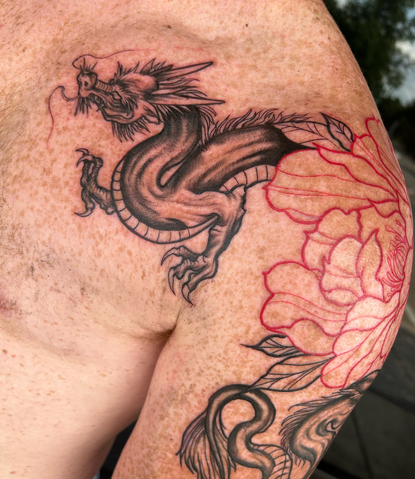 Dragon and peony realism tattoo on the shoulder by Tattoo Seattle Anime Japanese San Francisco
