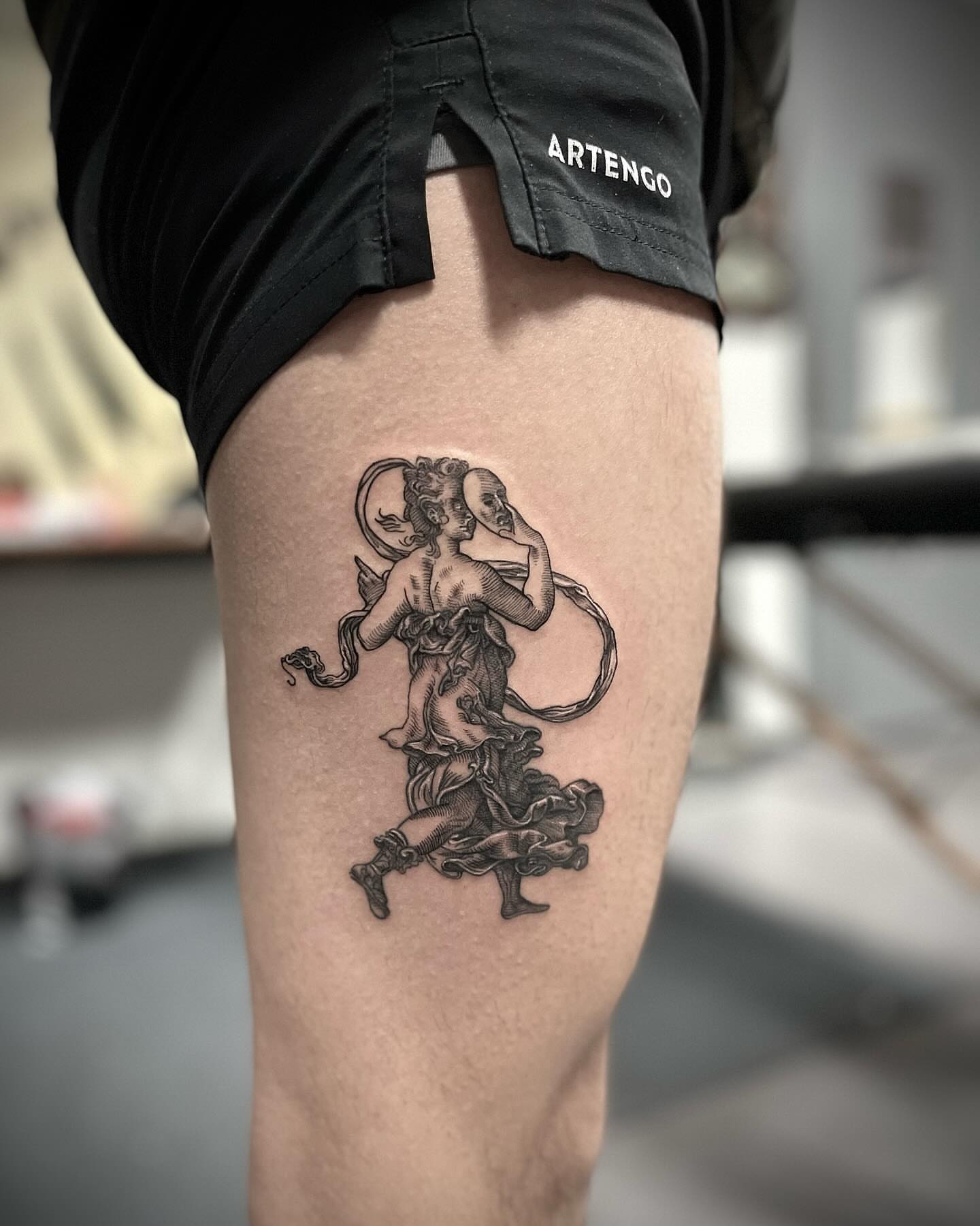 Mermaid black and grey tattoo on the thigh by Tattoo Artist