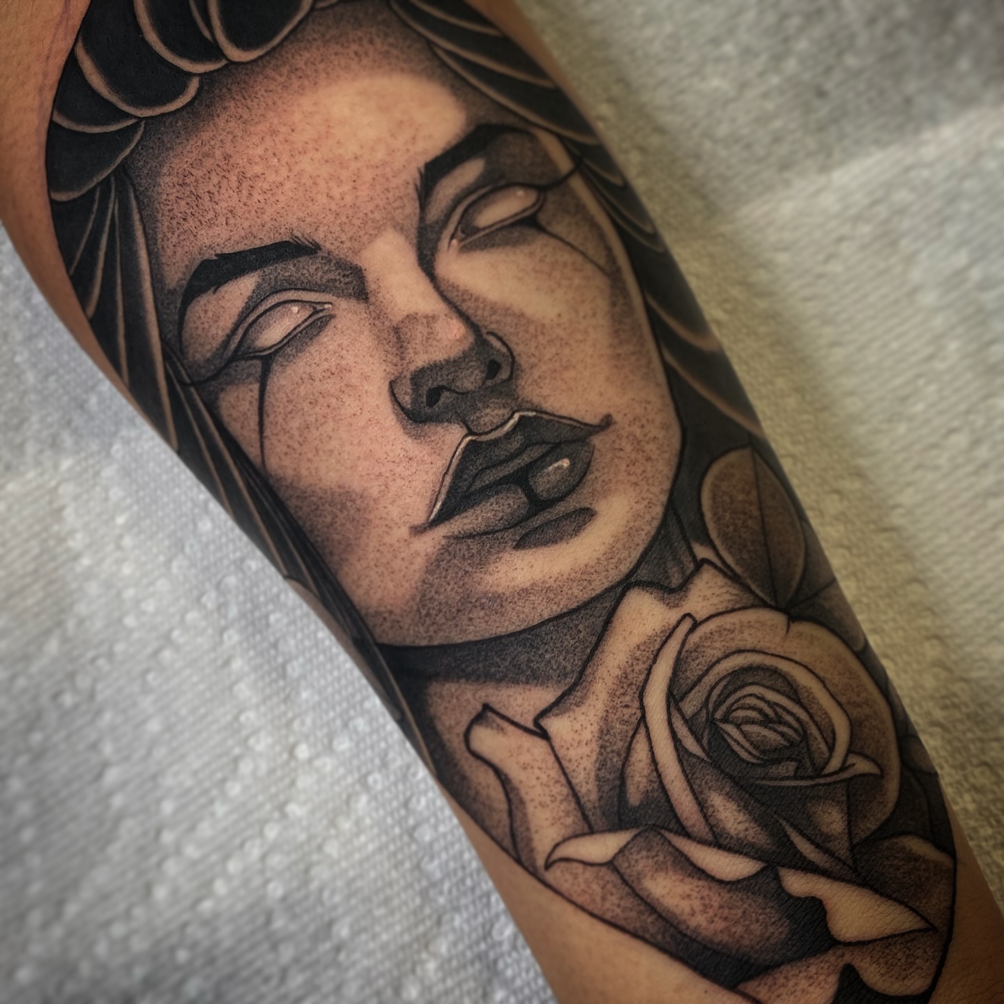 Woman with rose dotwork tattoo on the forearm by Angel Rodriguez