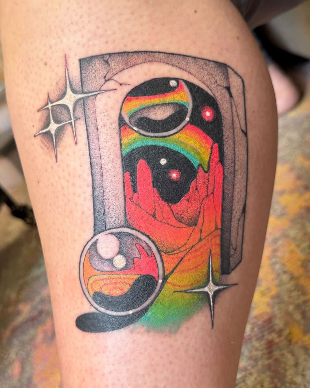 Abstract surrealistic design surrealism tattoo on the thigh by Carly Zehring