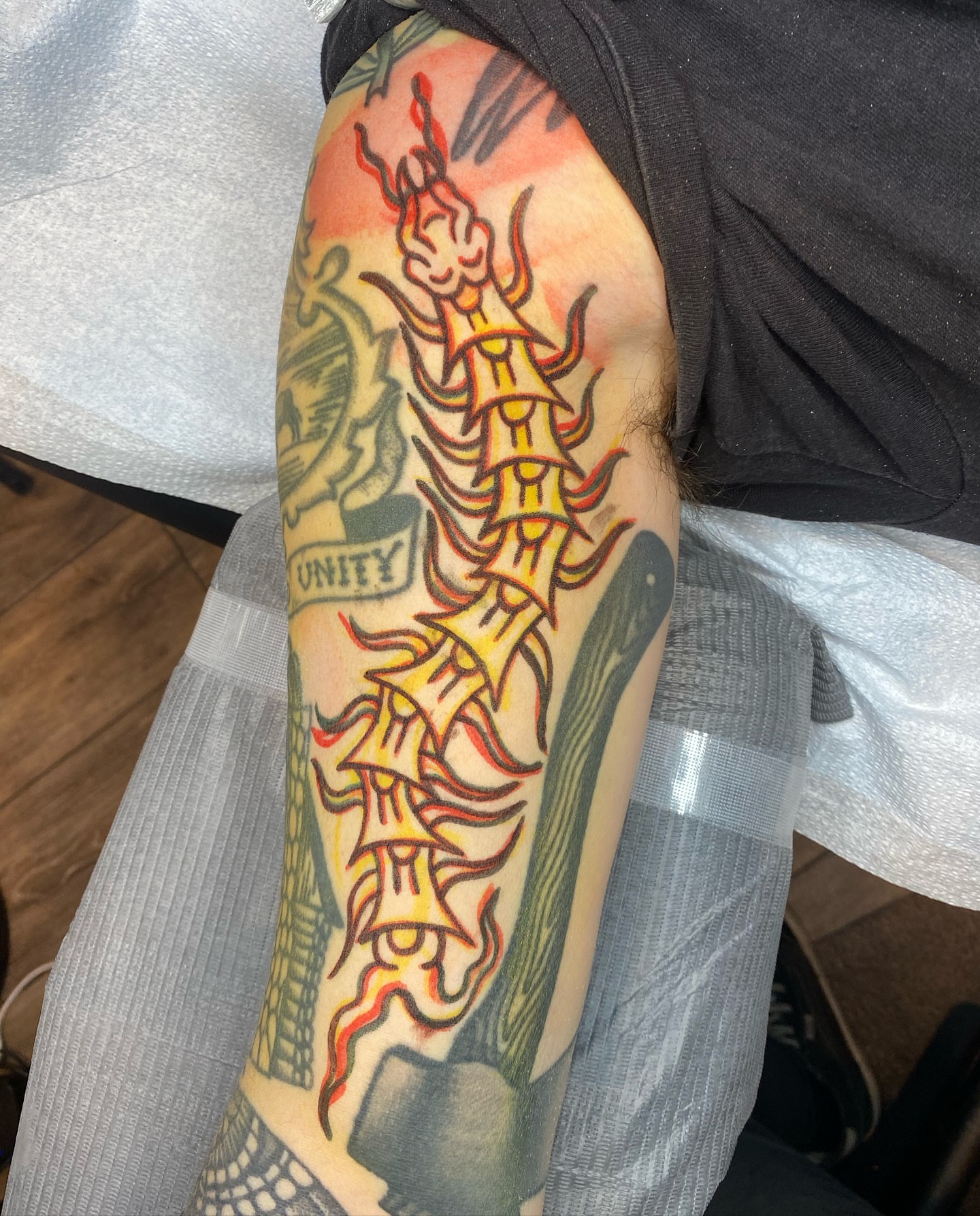 Flame and skull American traditional tattoo on the forearm by The Calamari Kid