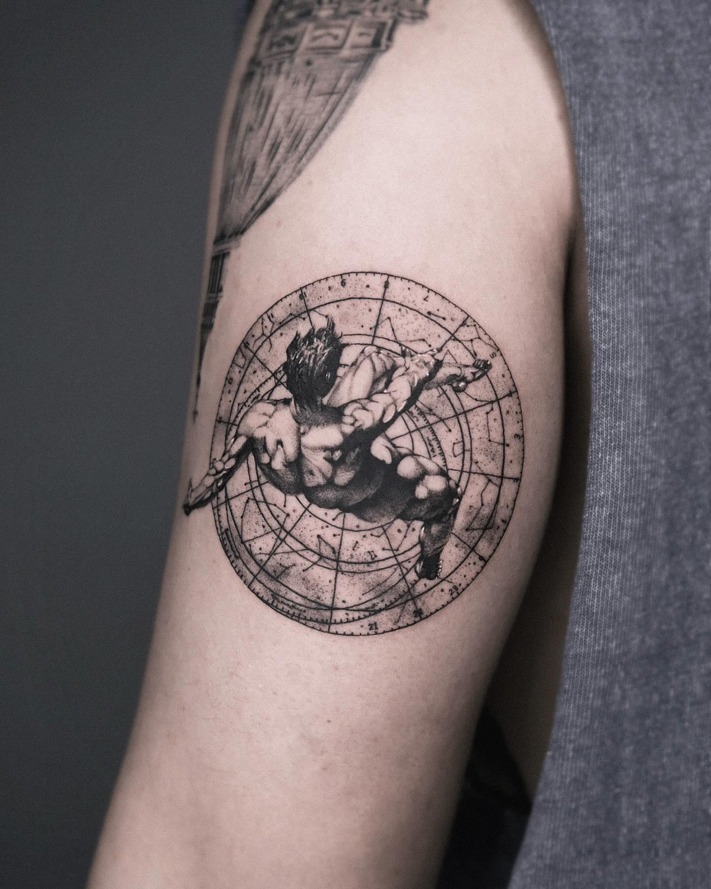 Action figure black and grey tattoo on the forearm by Seraph Geometry
