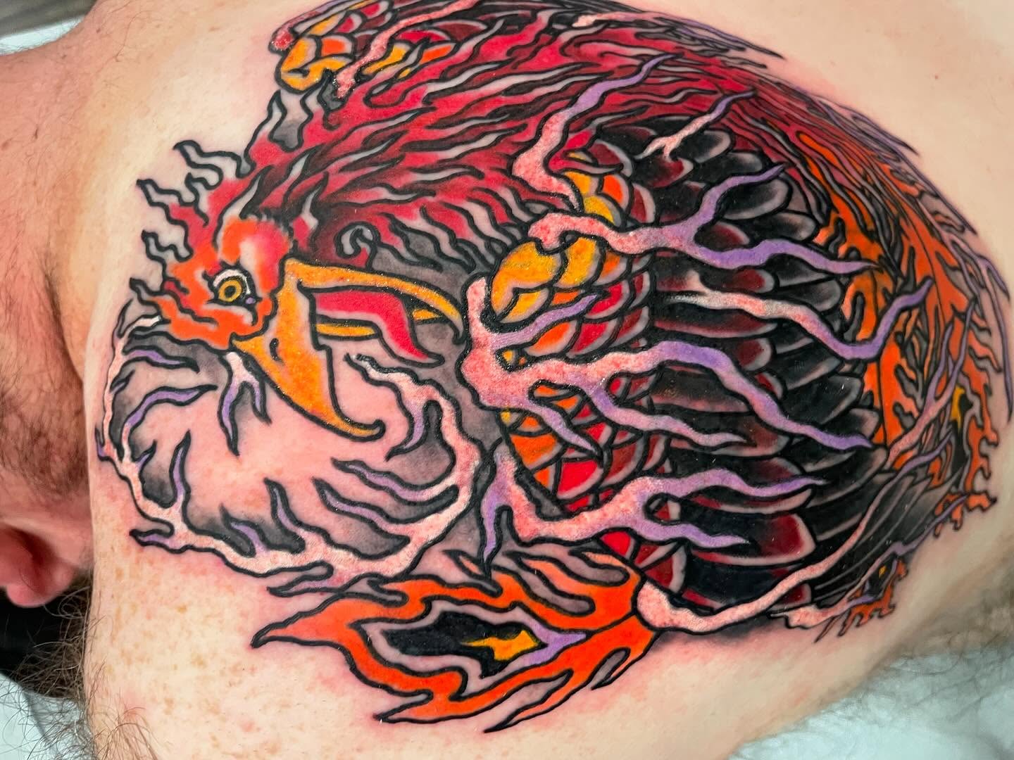 Rooster new school tattoo on the chest by Caleb Baker