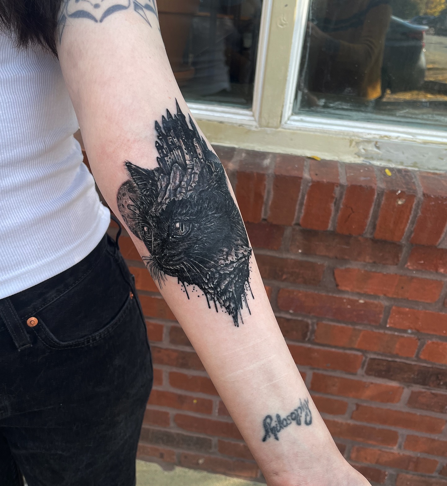 Cat realism tattoo on the forearm by Danielle