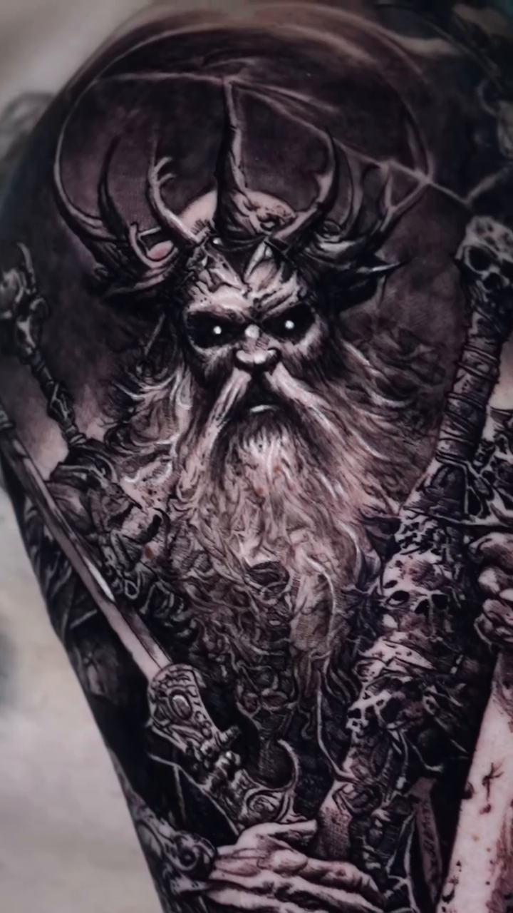Viking warrior with axe and skulls dark realism tattoo by Ryan Gage Gonzalez