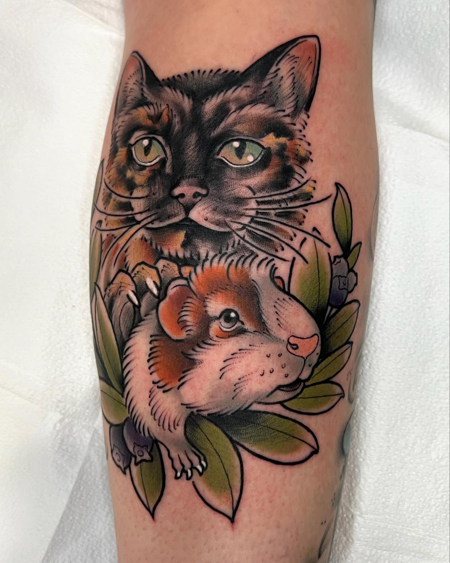 Cat and hamster American traditional tattoo on the forearm by Kyle Olson, Salt Lake City, Utah