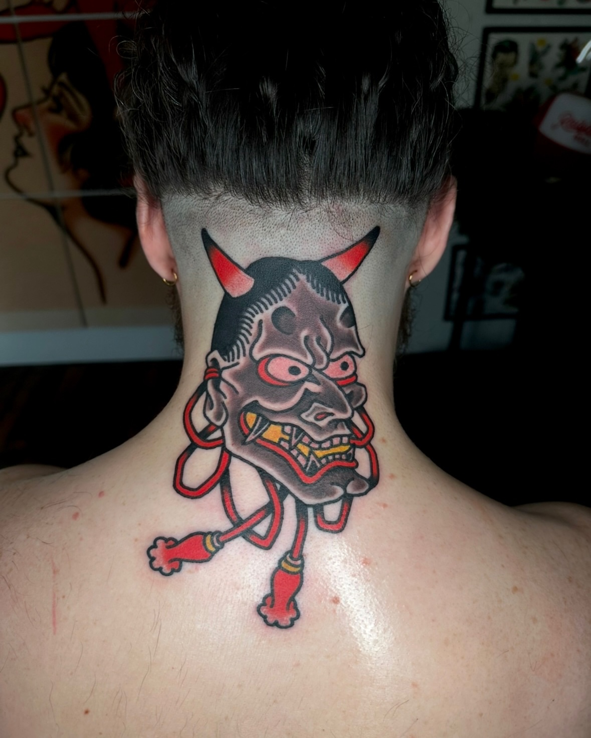 Demon mask American traditional tattoo on the neck by Steve Pearson