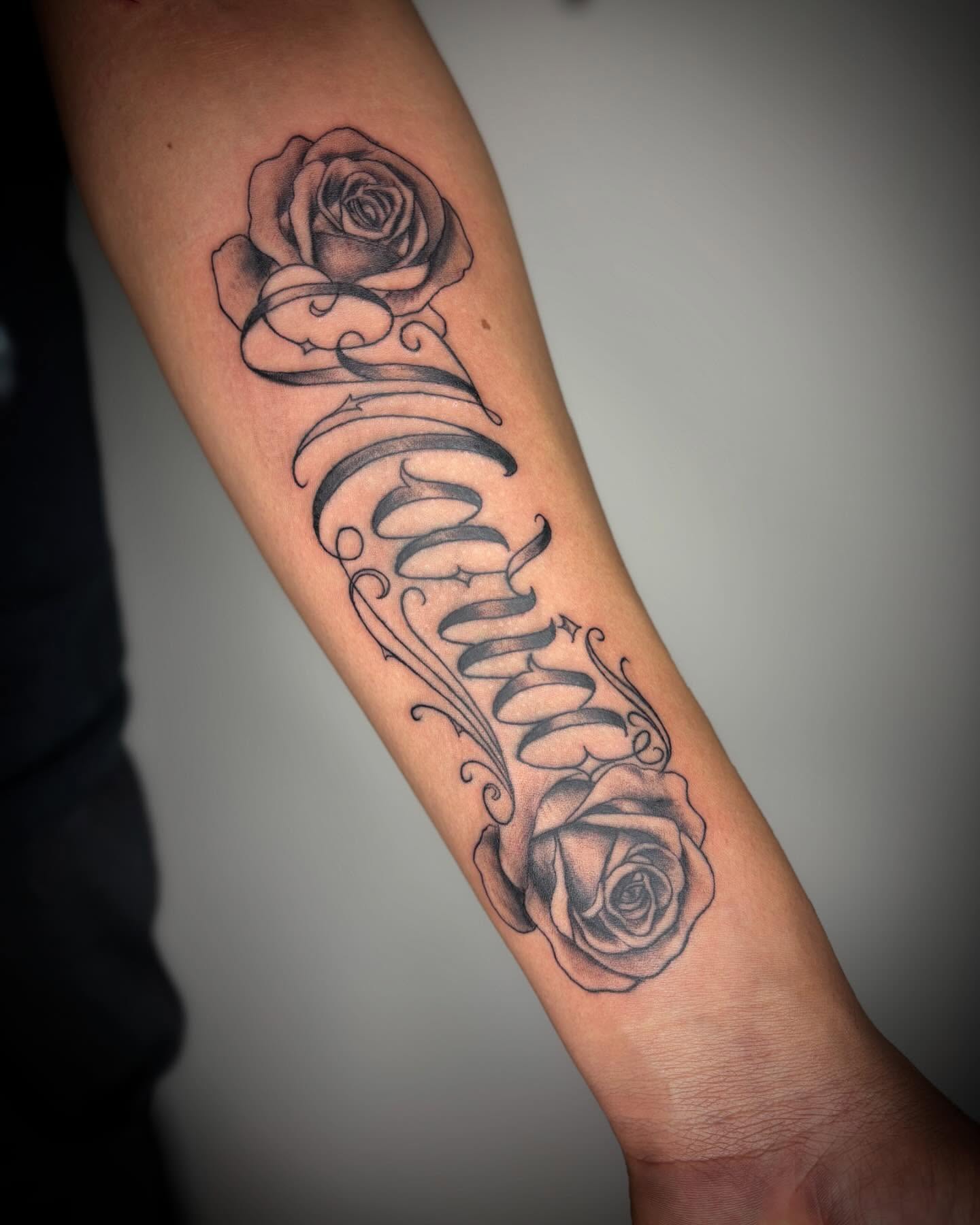 Roses and scrollwork realism tattoo on the forearm by Adrian Ram 🇬🇾🇵🇭