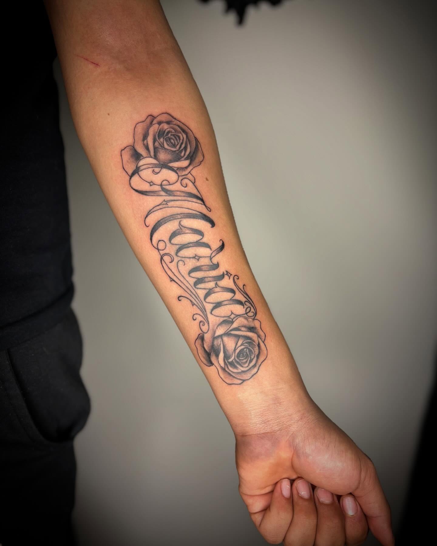 Scroll with roses black and grey tattoo on the forearm by Adrian Ram 🇬🇾🇵🇭