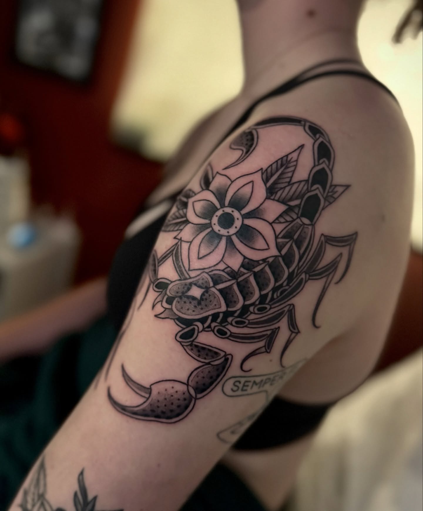 Scorpion and flower black and grey tattoo on the shoulder by Andi Fitz ✨ San Diego Tattoo Artist, San Diego, California