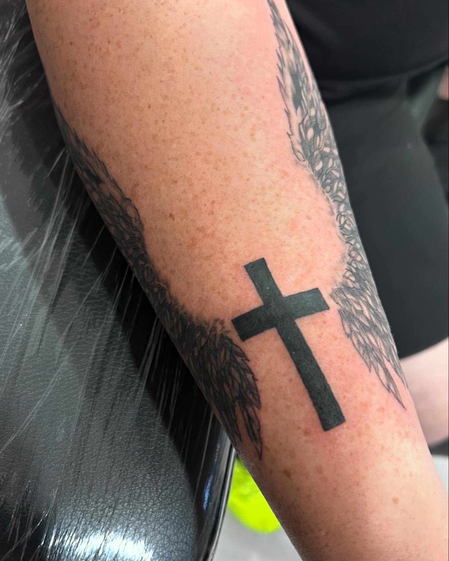 Cross black and grey tattoo on the forearm by Jbtattoo Artistry