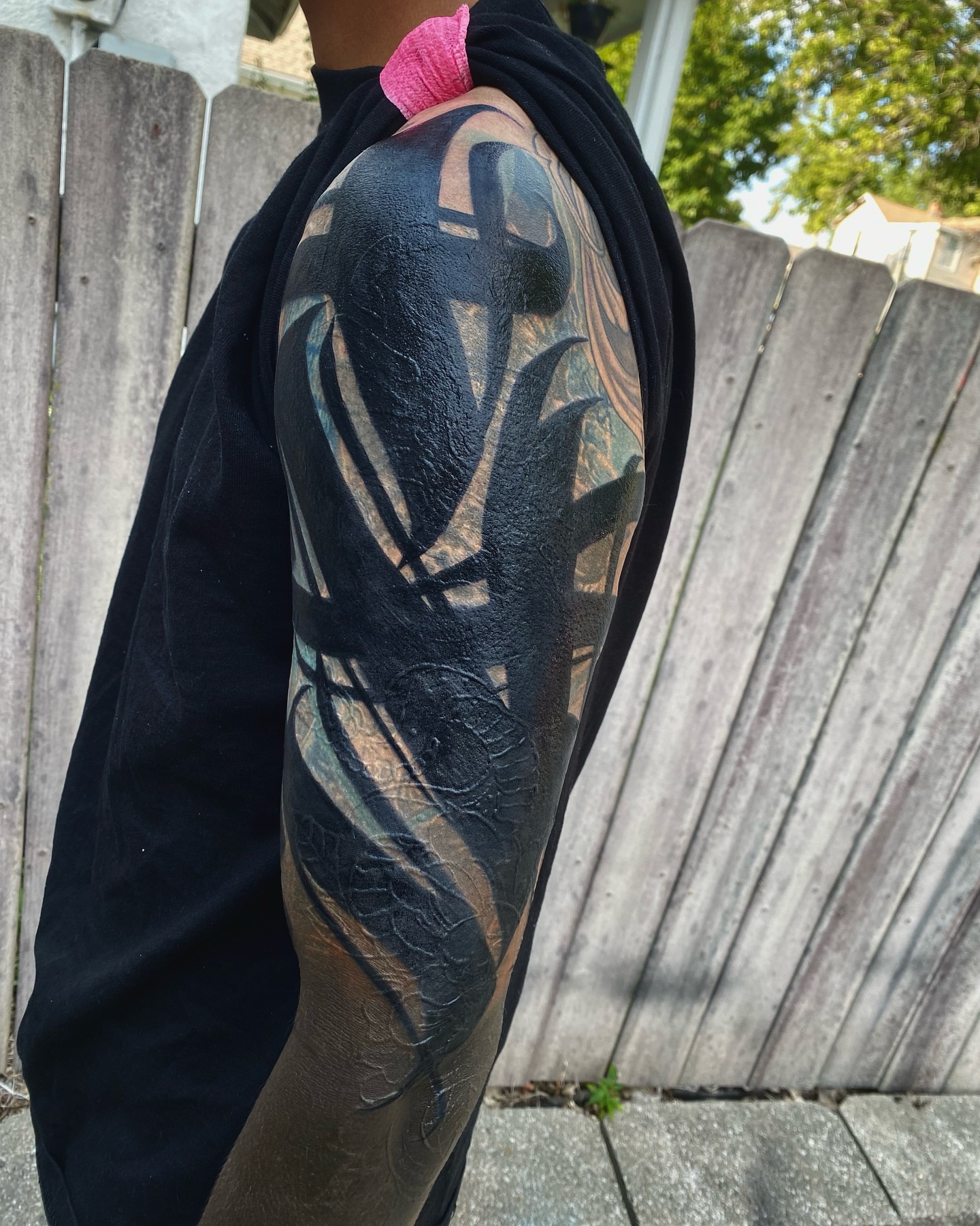 Abstract design black and grey tattoo on the upper arm by Tattertot