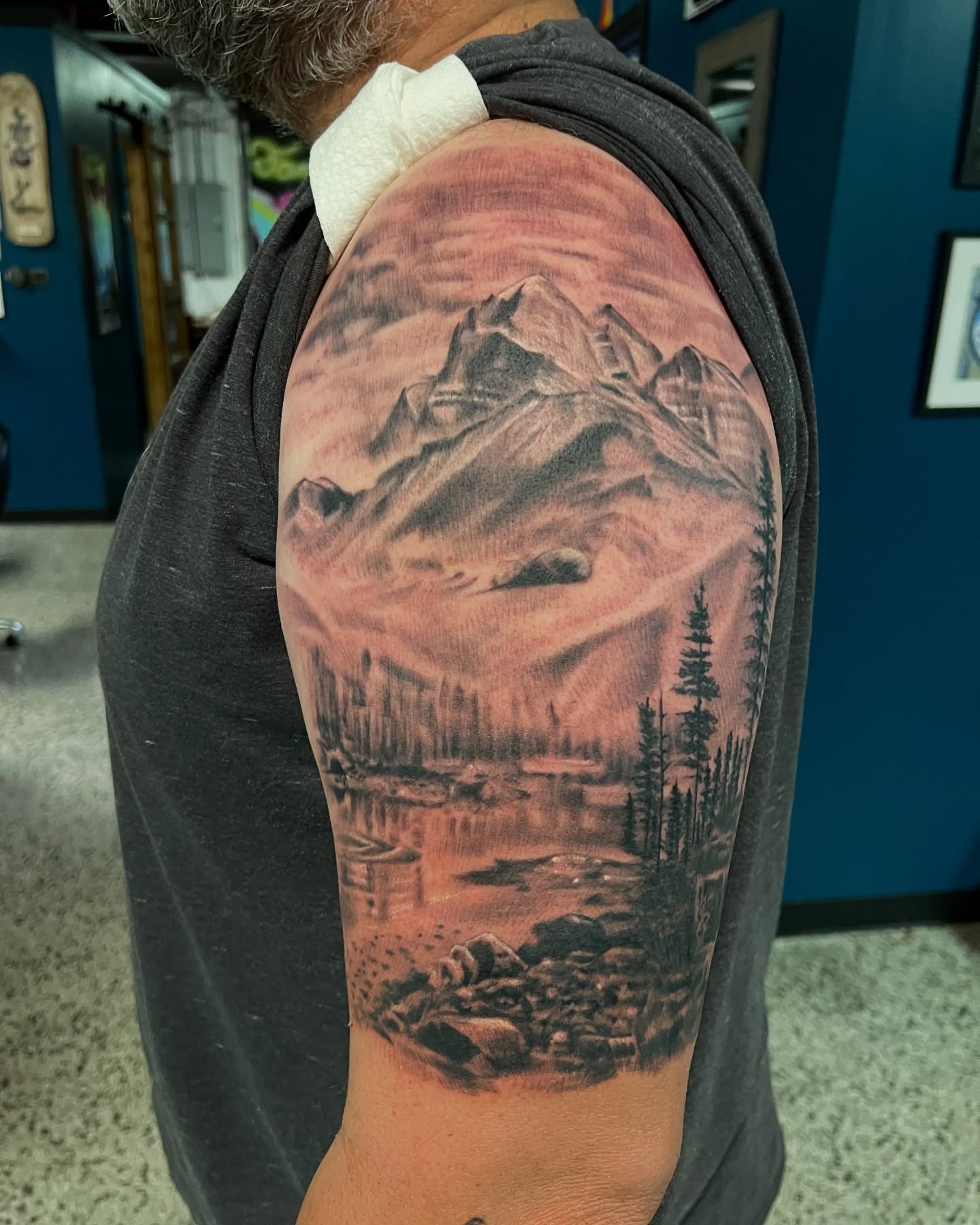 Mountain landscape realism tattoo on the shoulder by Krys King Tattoos