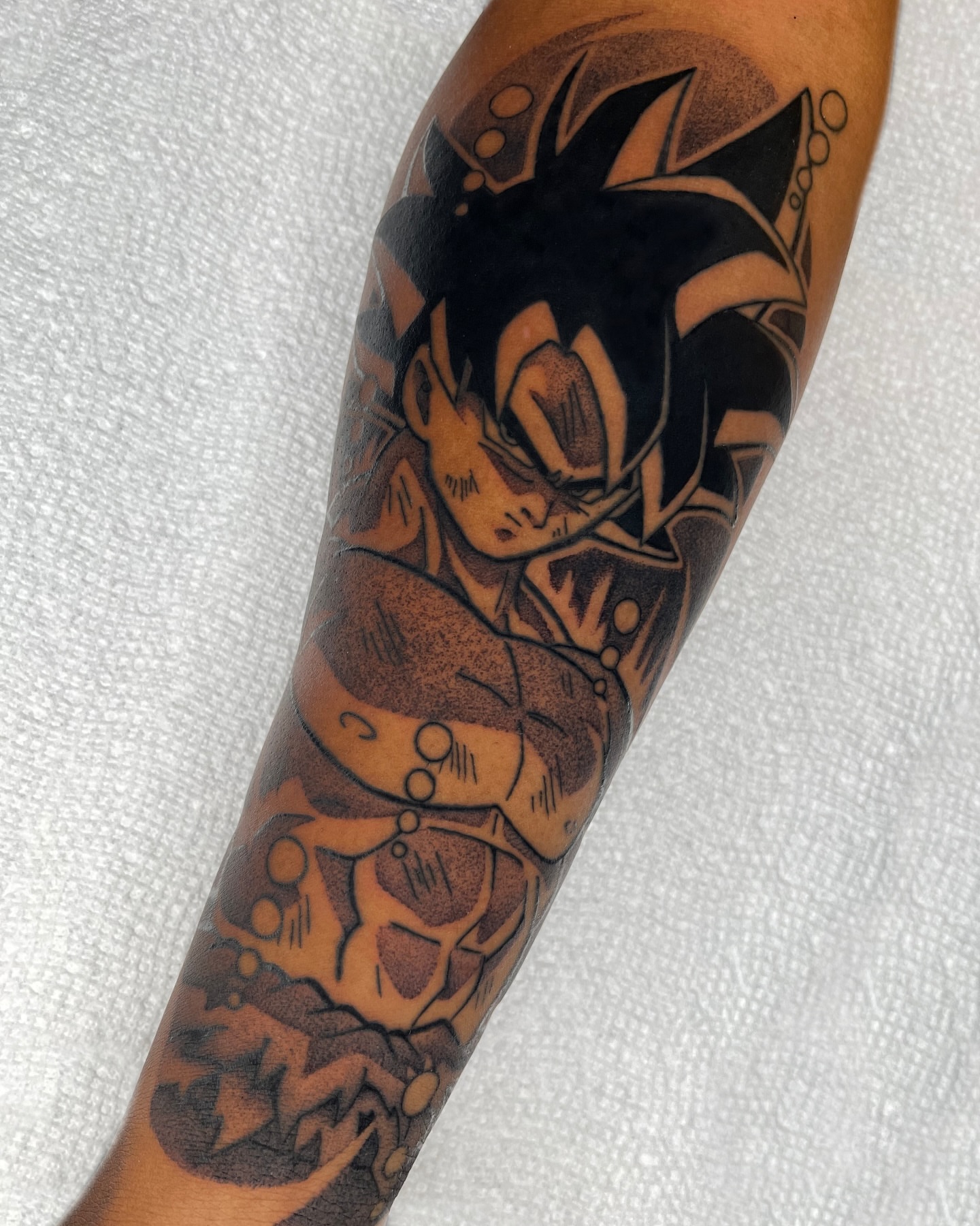 Son gokuu anime tattoo on the forearm by Anastasia Vives