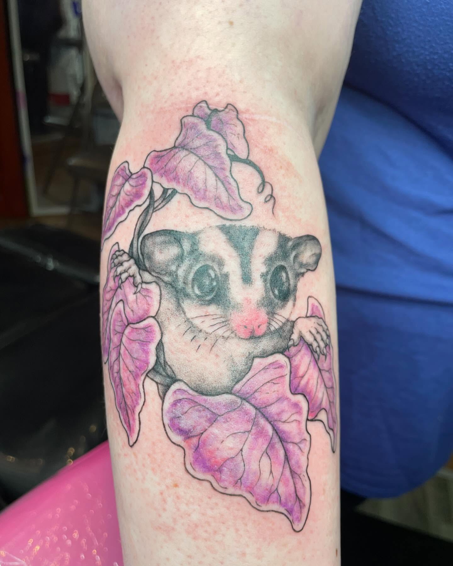 Sugar glider and leaves realism tattoo on the forearm by Christin Baumgart