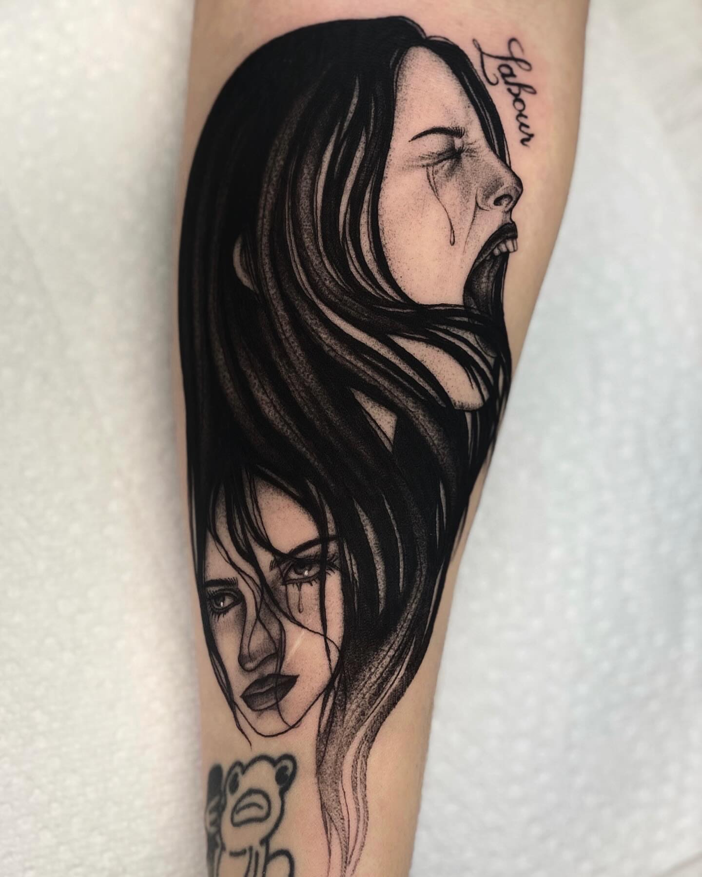 Woman crying realism tattoo on the forearm by jada