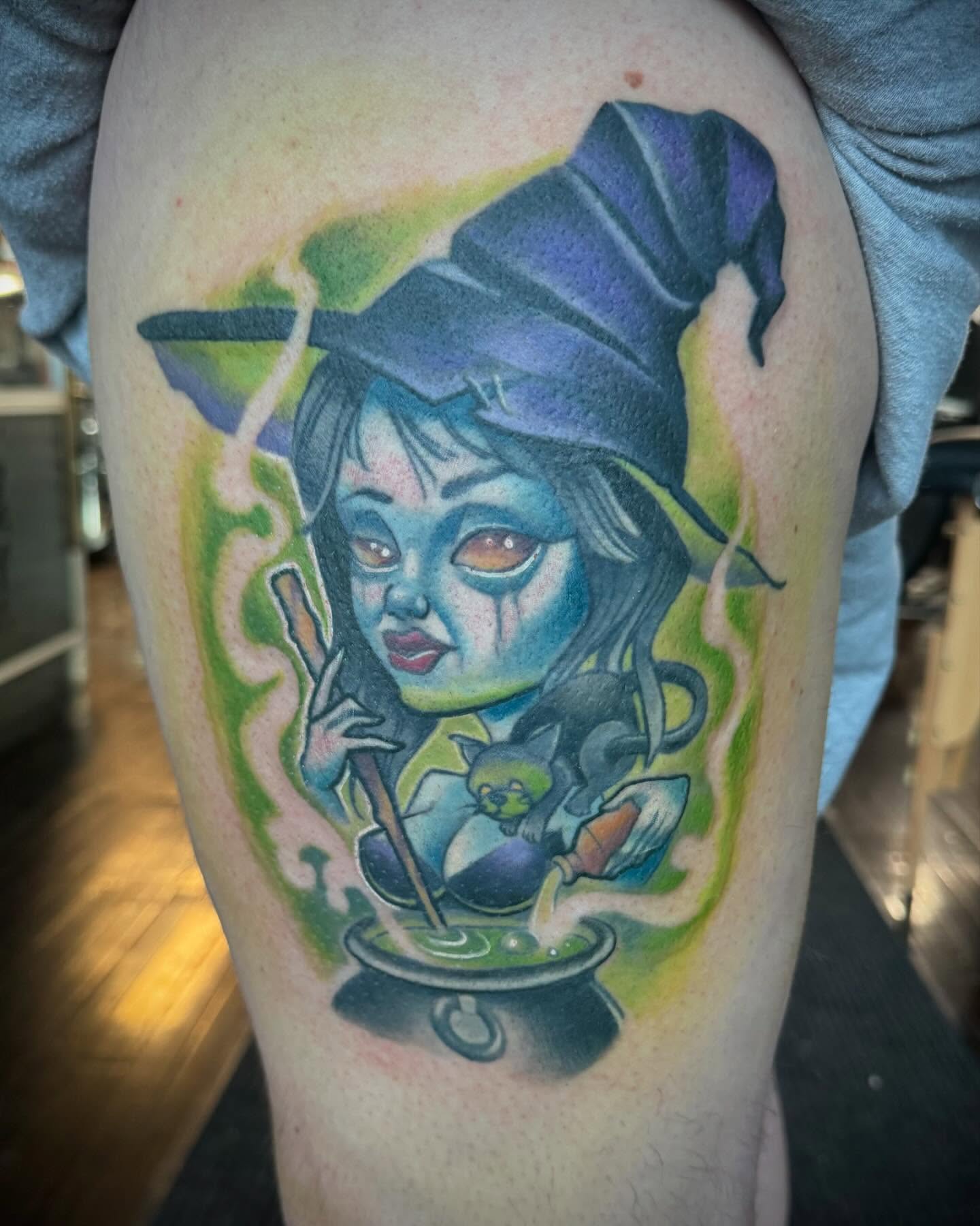 Witch realism tattoo on the thigh by Paul Hicks