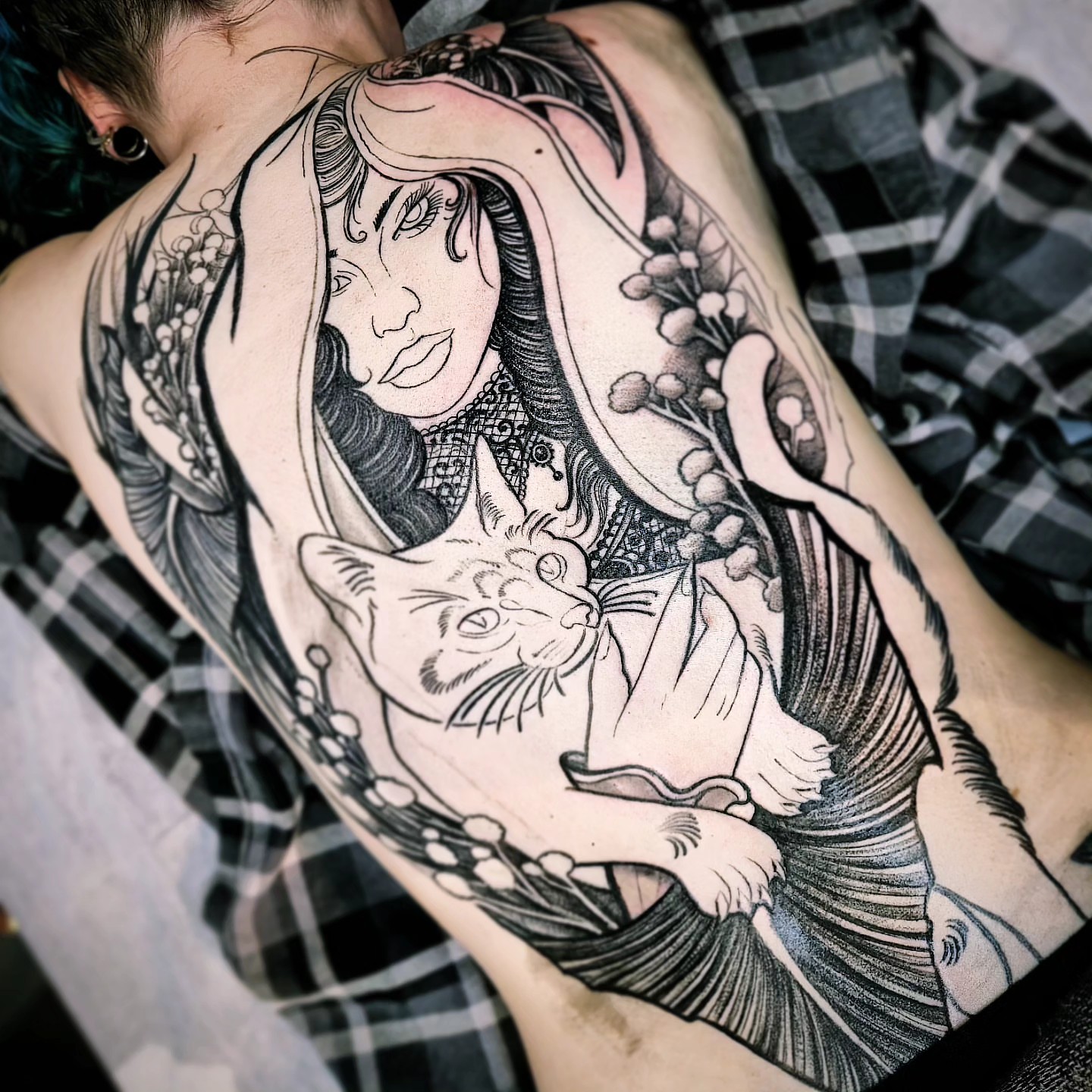 Woman with cat realism tattoo on the back by Barrett Handel