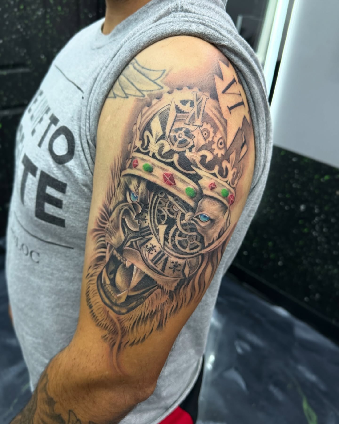 Lion with crown realism tattoo on the shoulder by 302inkgod, Wilmington, Delaware