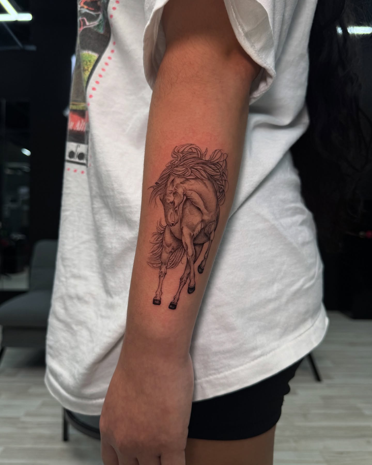 Galloping horse realism tattoo on the forearm by Nicolas Herrera
