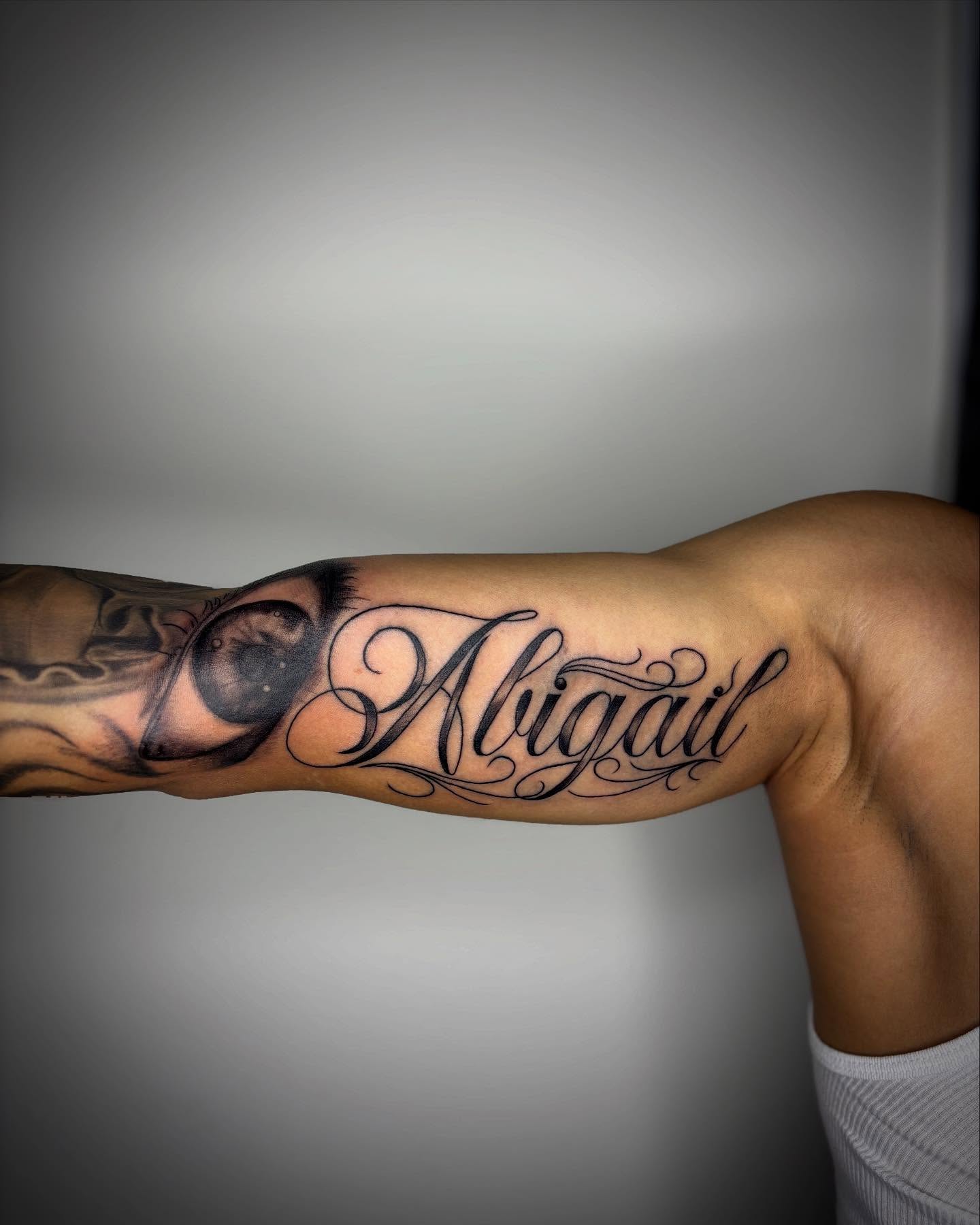 Abigail lettering script tattoo on the forearm by Adrian Ram 🇬🇾🇵🇭