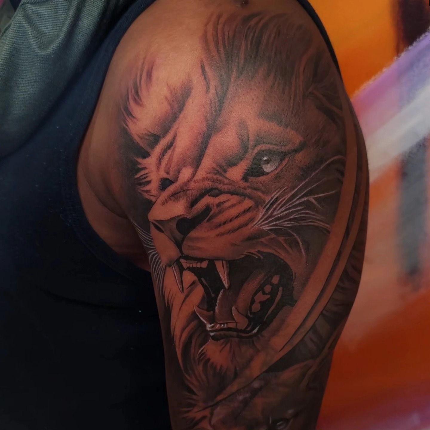Lion realism tattoo on the shoulder by Ana Fajardo