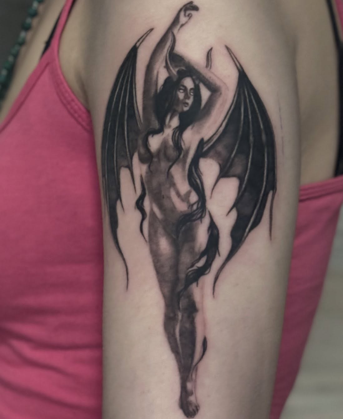 Winged woman realism tattoo on the forearm by jordy