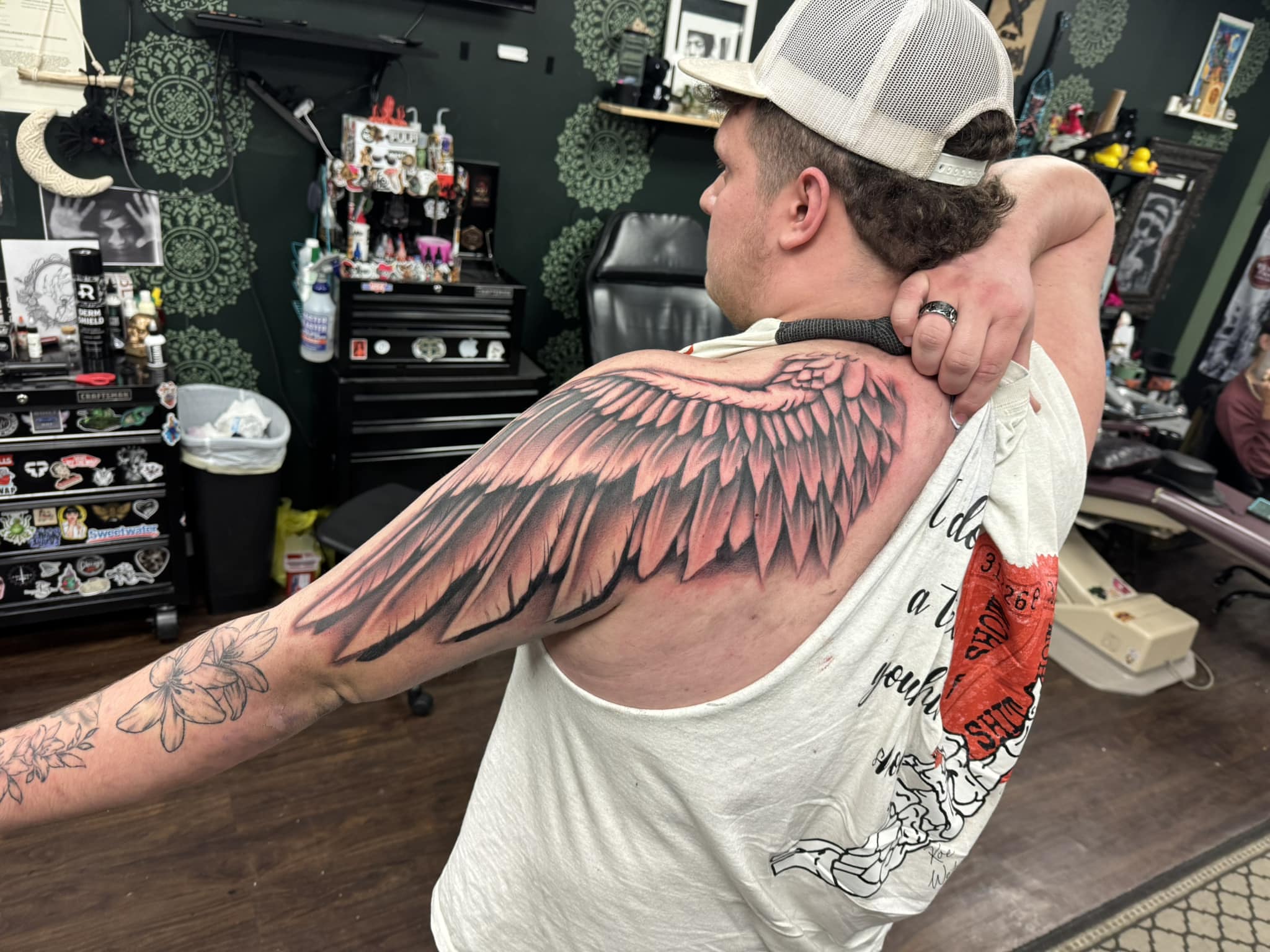 Wing realism tattoo on the shoulder by Zacharee Osborn