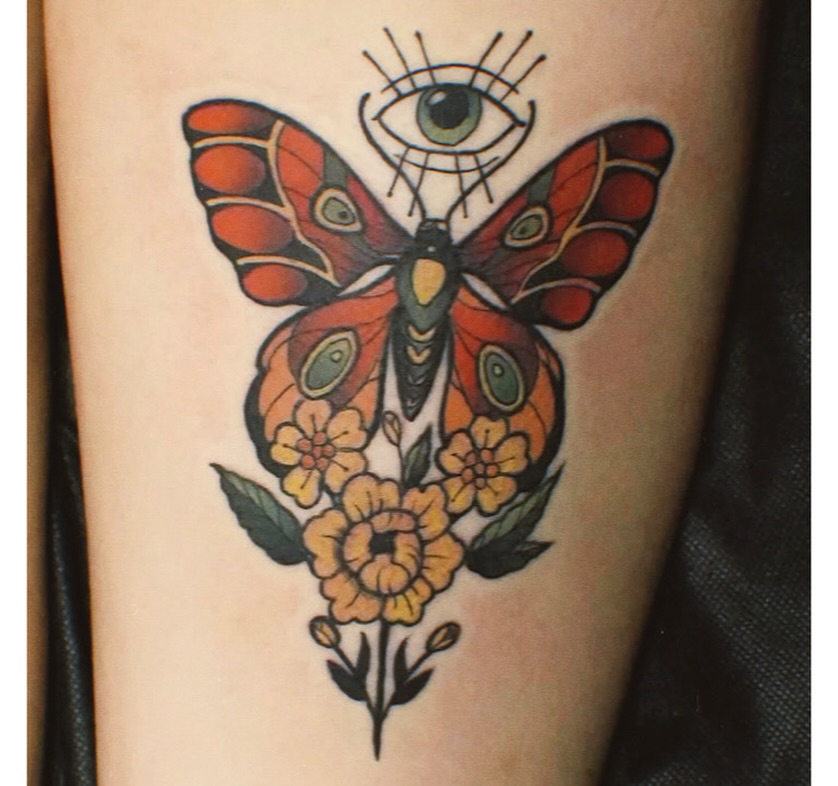 Butterfly and flowers American traditional tattoo on the forearm by Jamie Clinton