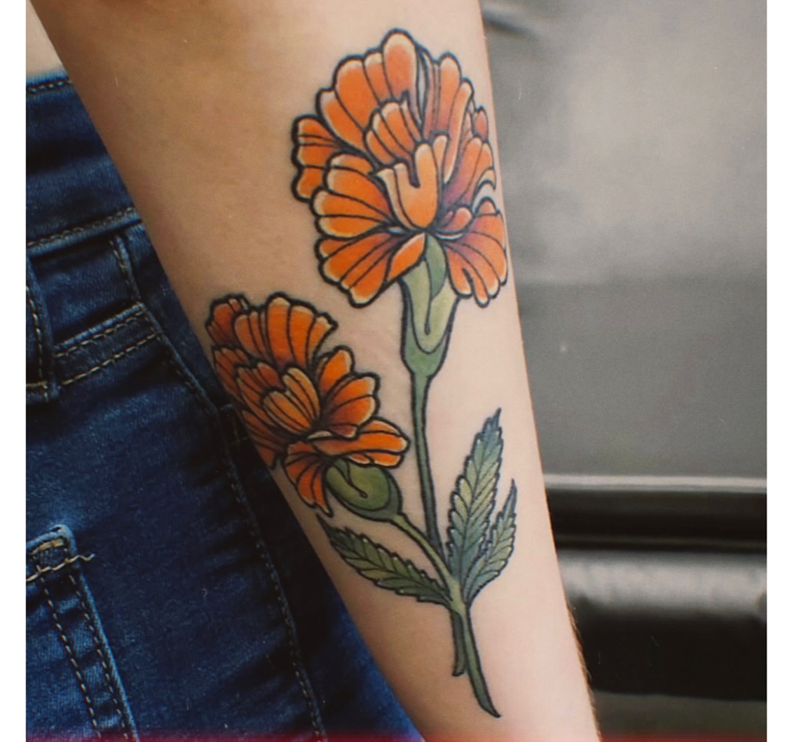 Marigold flowers realism tattoo on the forearm by Jamie Clinton