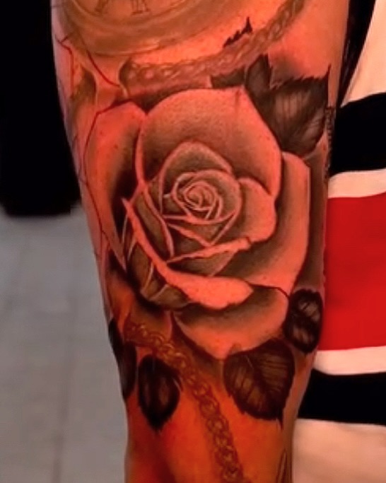 Rose realism tattoo on the forearm by Greg Petrali