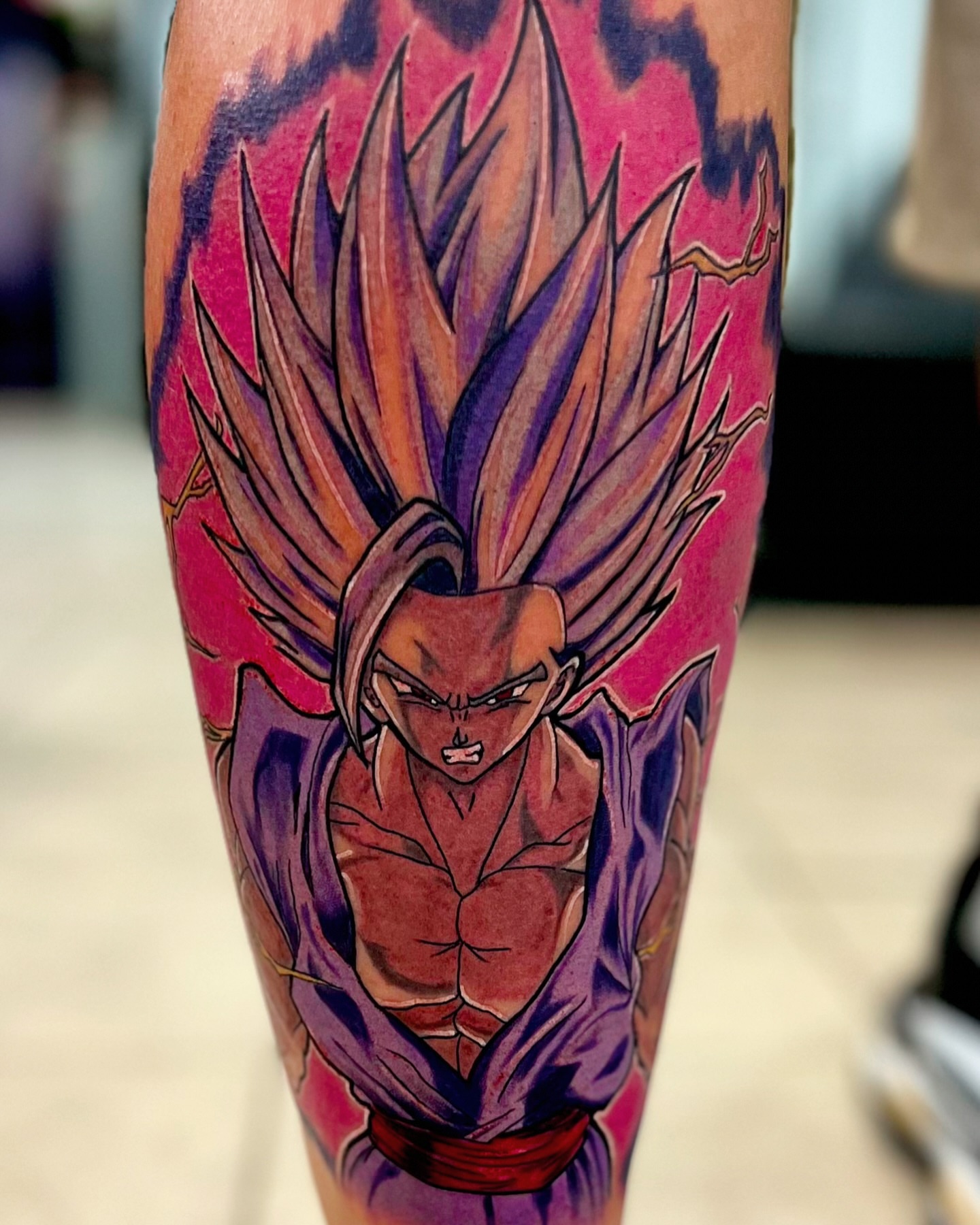 Super saiyan god ssj goku anime tattoo on the forearm by Greg Petrali