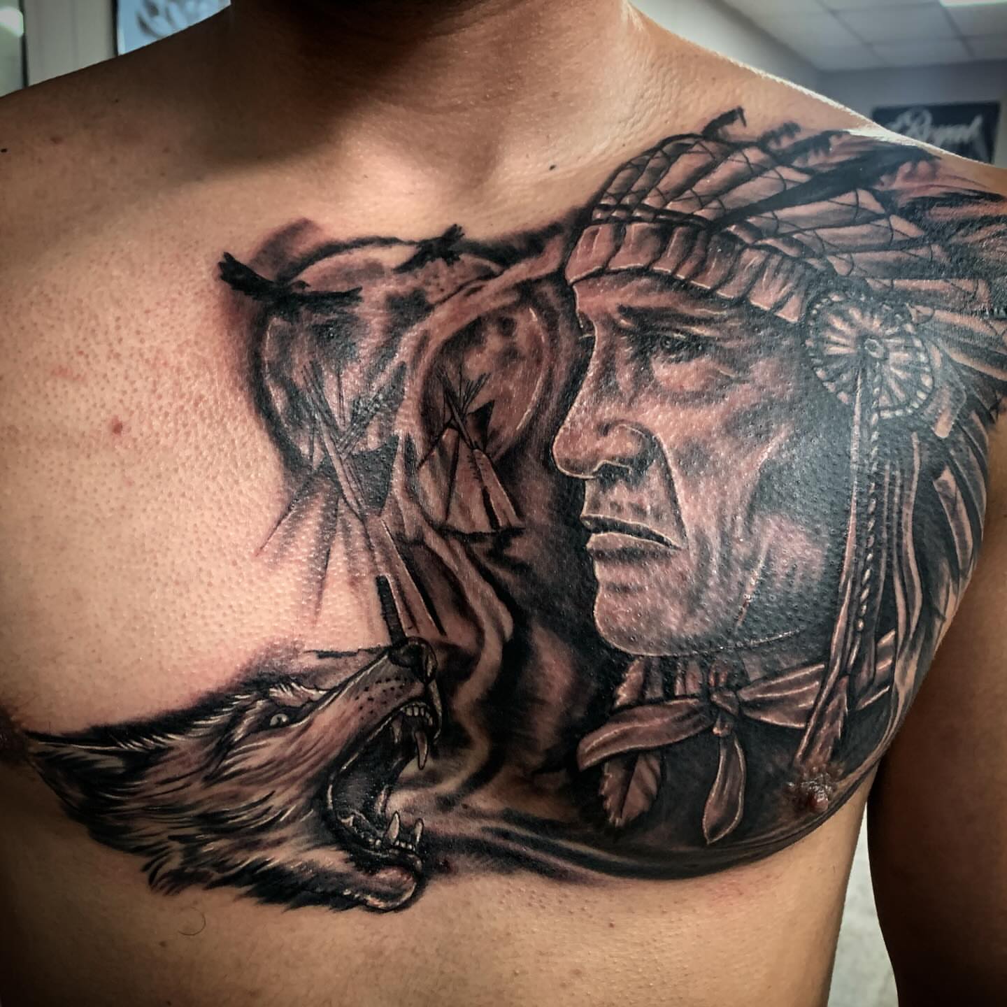 Indian chief and wolf realism tattoo on the chest by Tonii Florrez