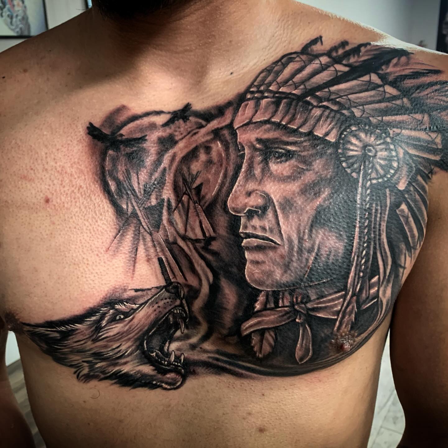 Indian chief and wolf realism tattoo on the chest by Tonii Florrez
