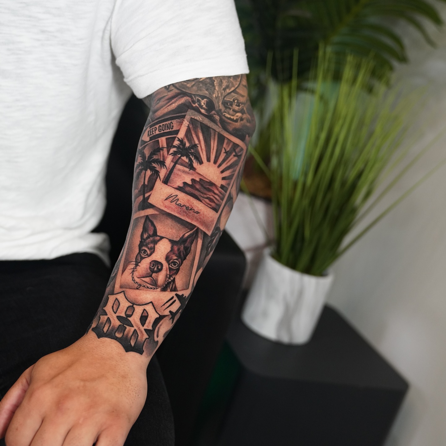 Dog and landscape black and grey tattoo on the forearm by Artem Kunakuzin