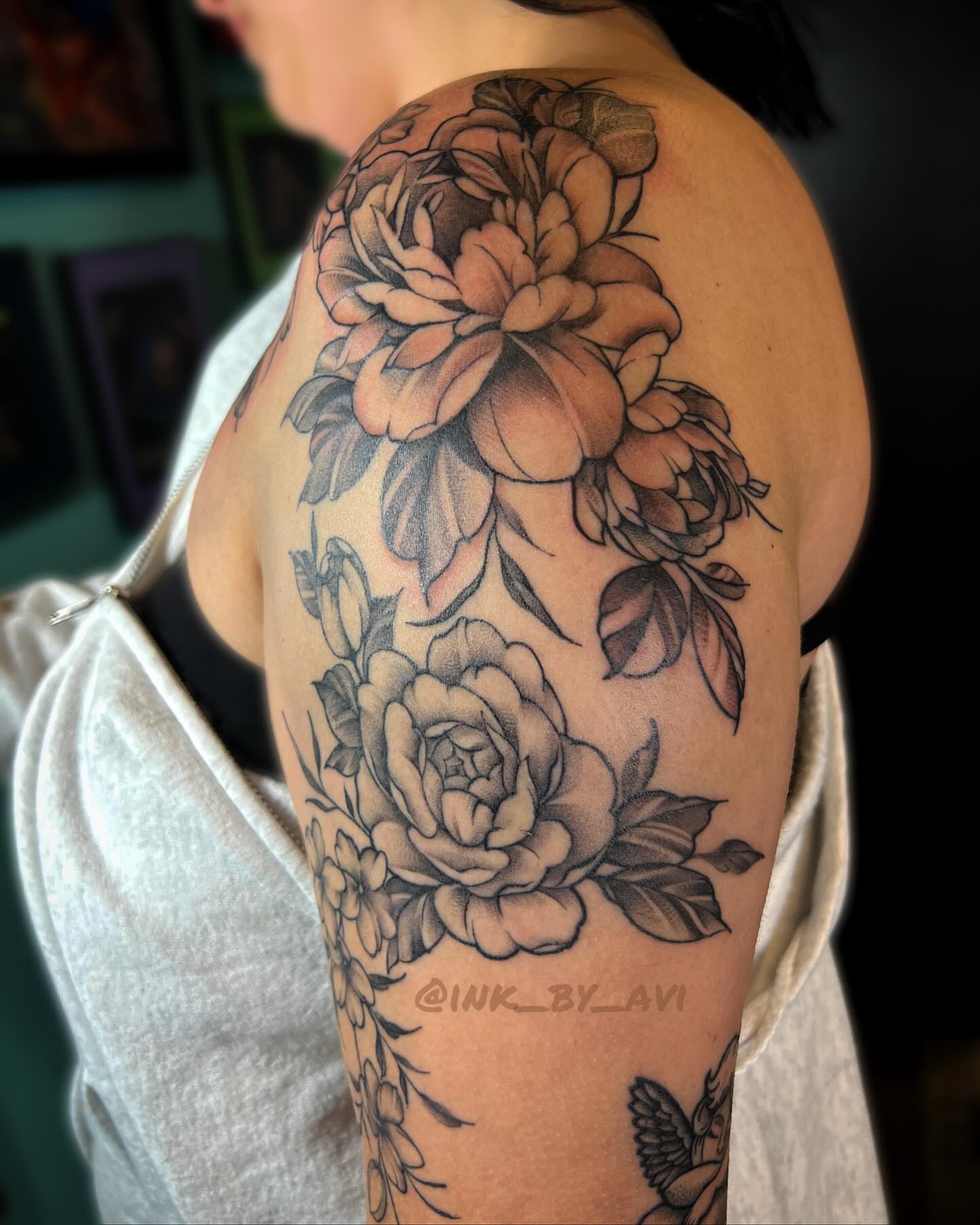 Peonies black and grey tattoo on the shoulder by Avi, Cleveland, Ohio